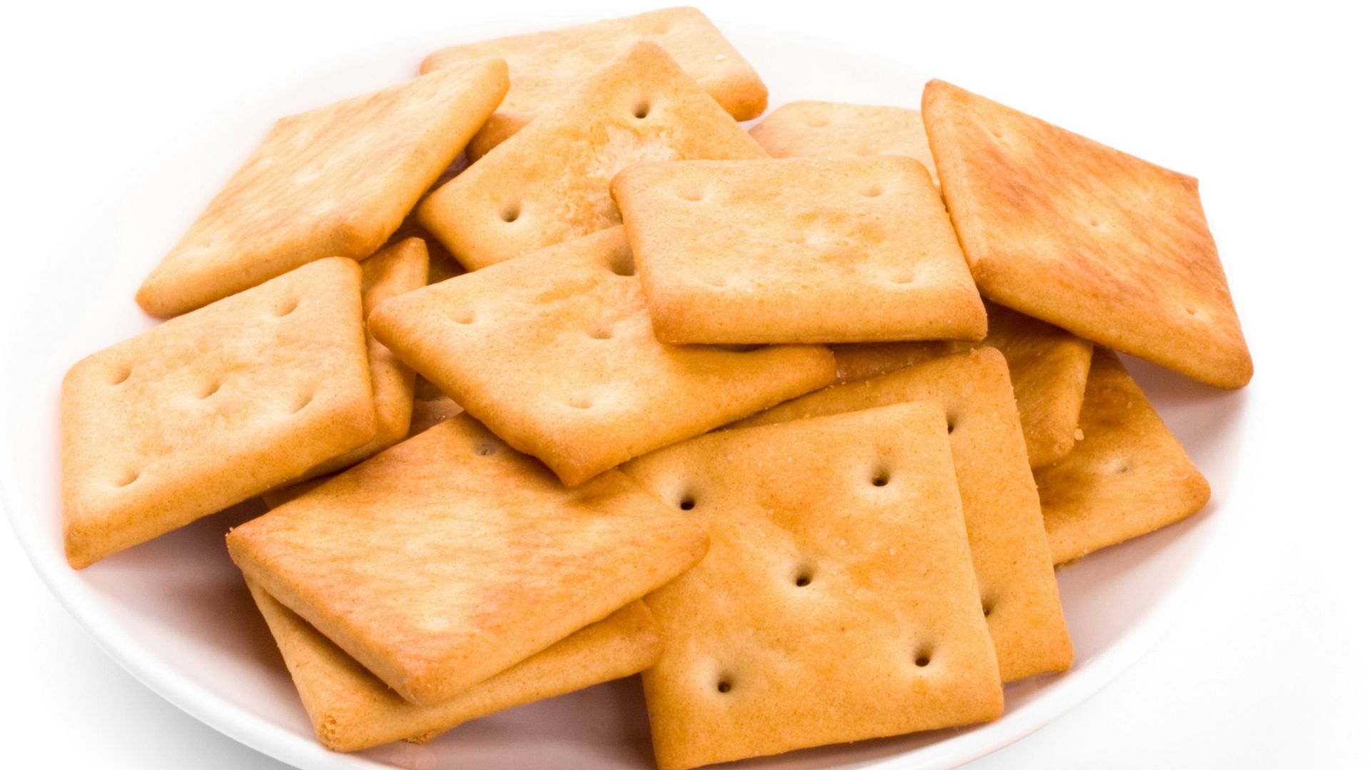 A plate of crackers on a white background