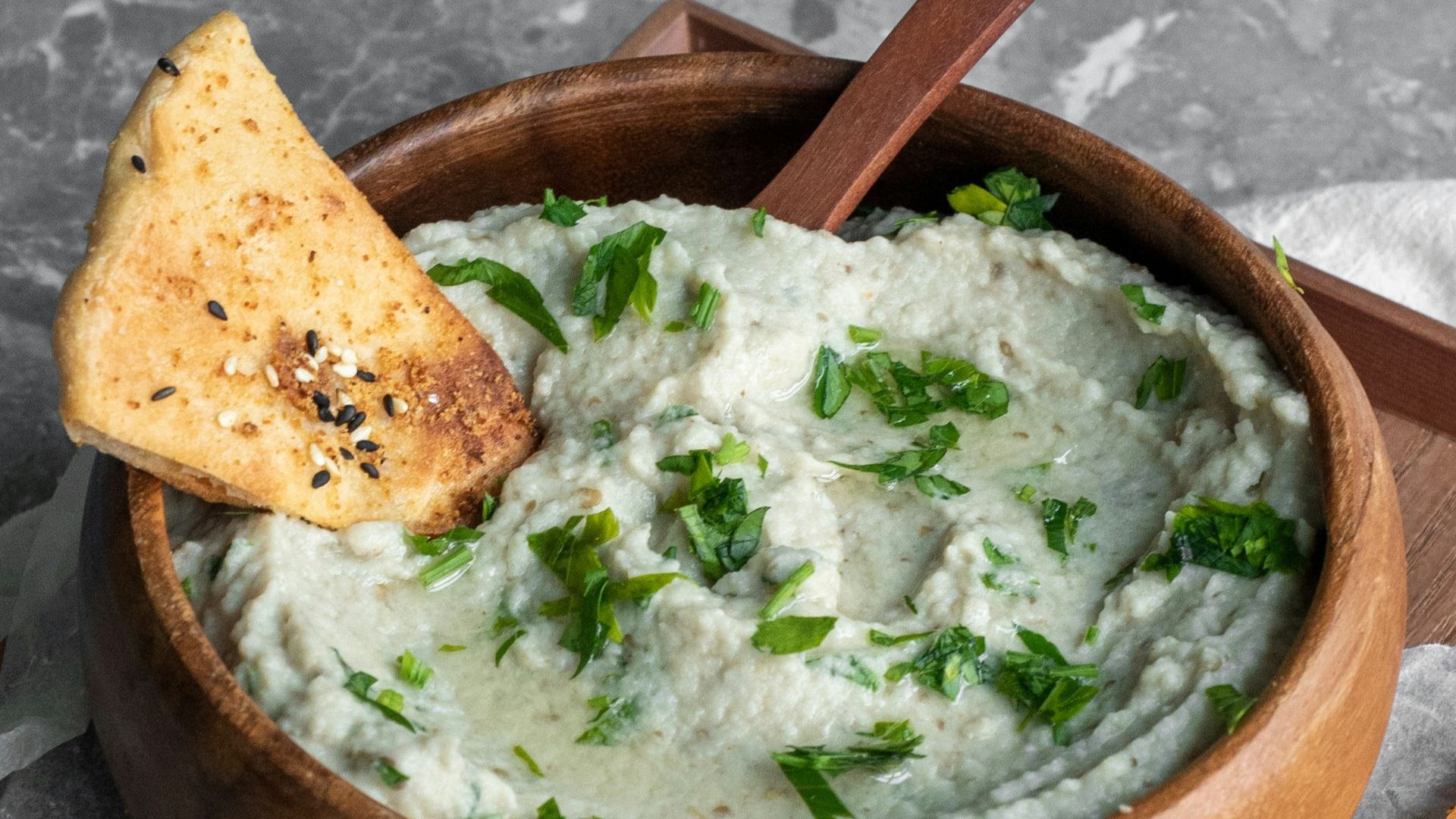 green soup on brown wooden bowl