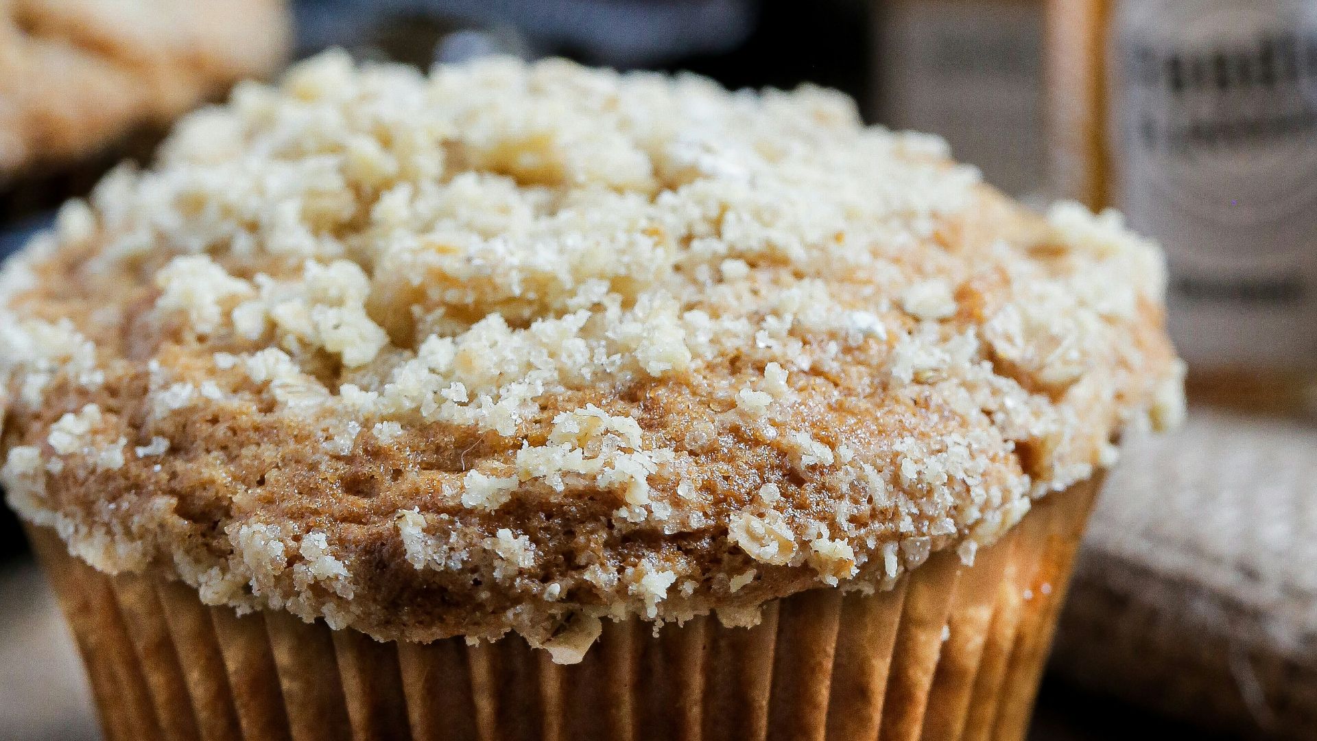 brown cupcake with white powder on top