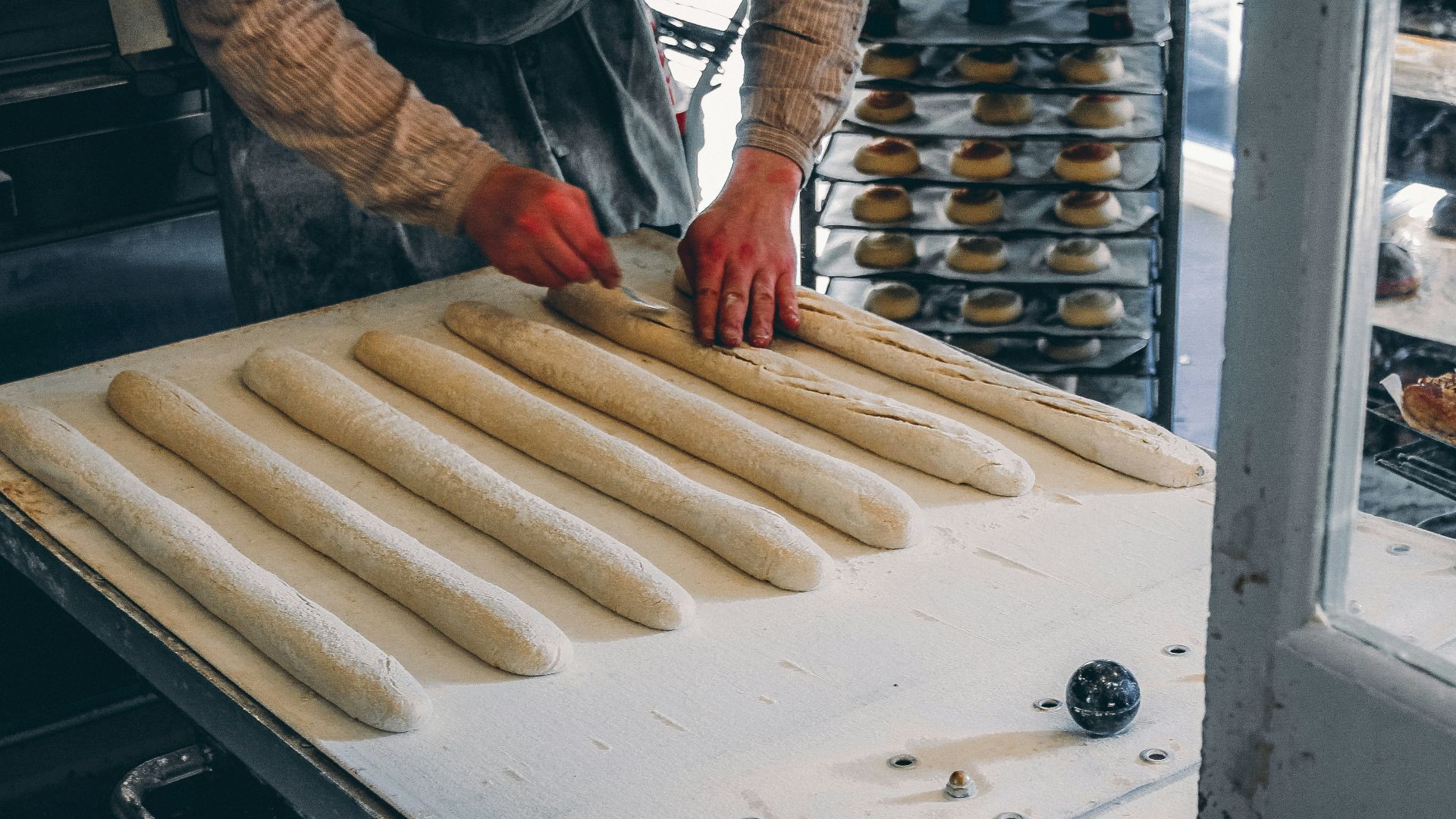 a person making a doughnut