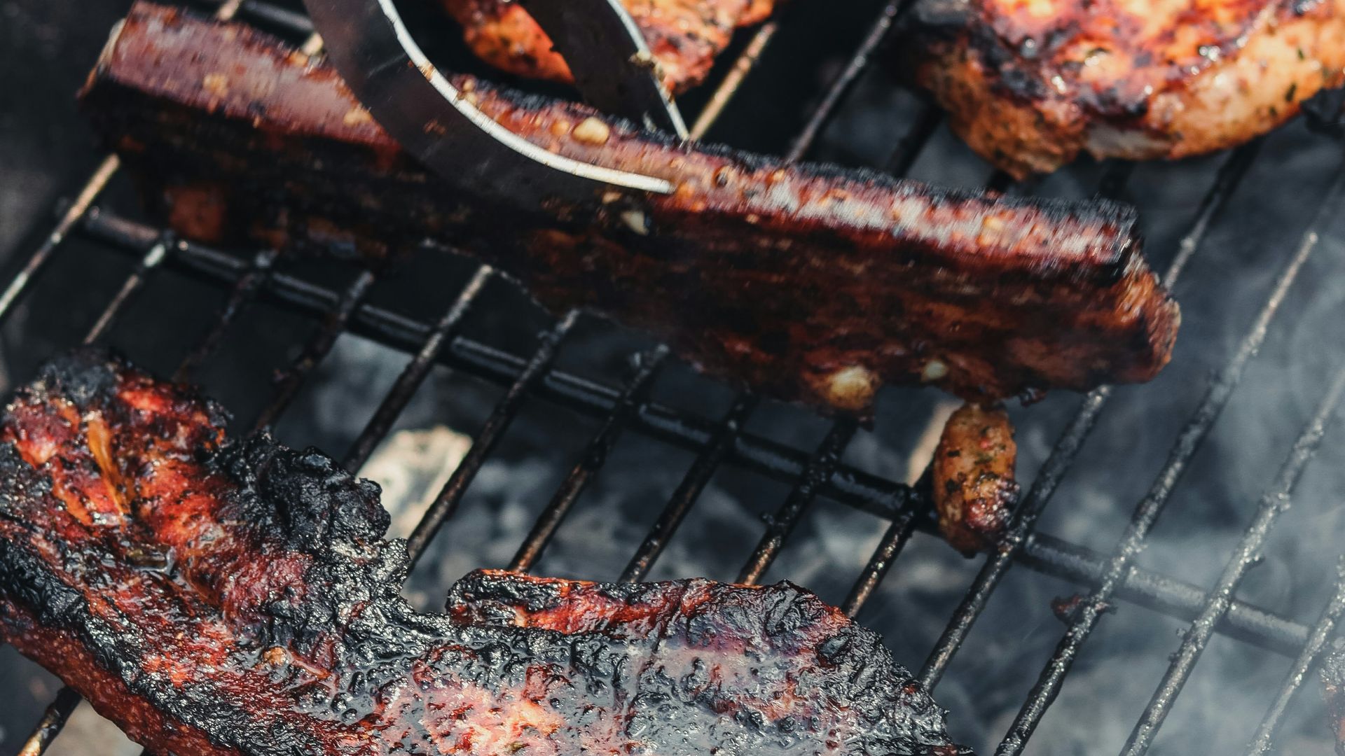 grilled meat on black charcoal grill