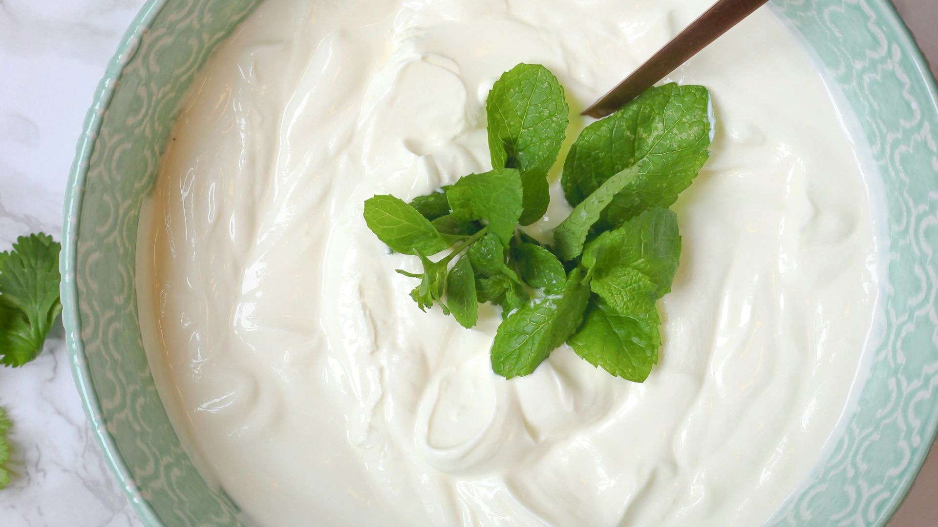 a bowl of yogurt with a spoon in it