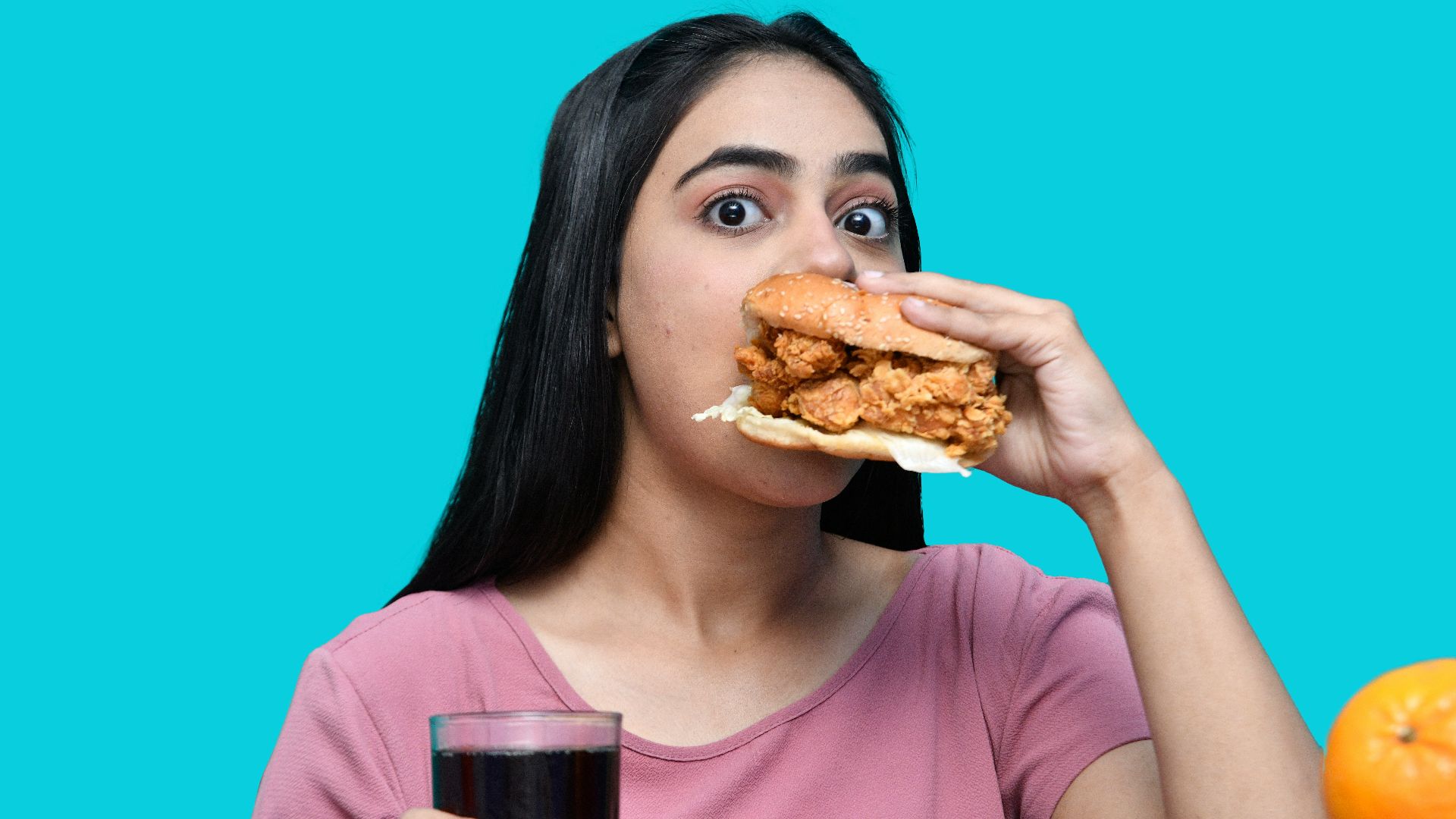 a woman eating a sandwich