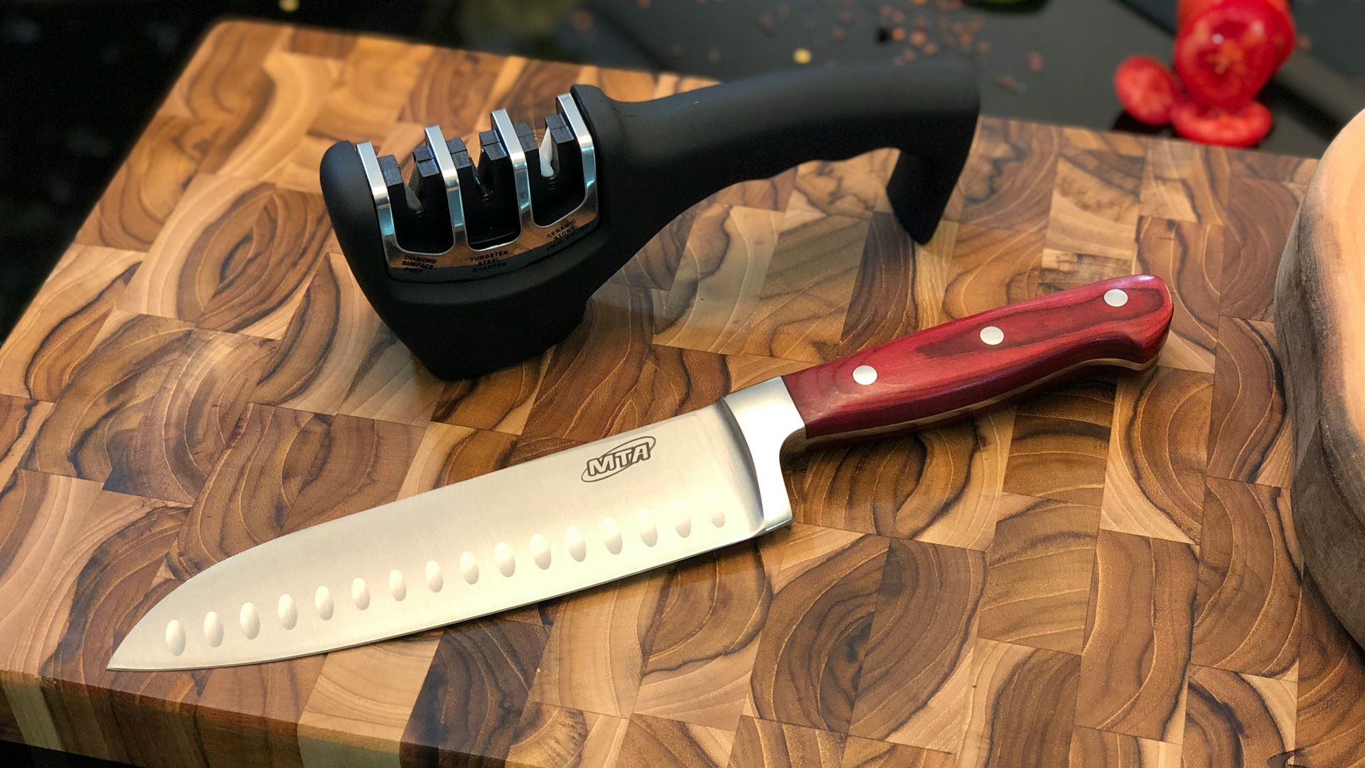 black handled knife beside black and white round ornament