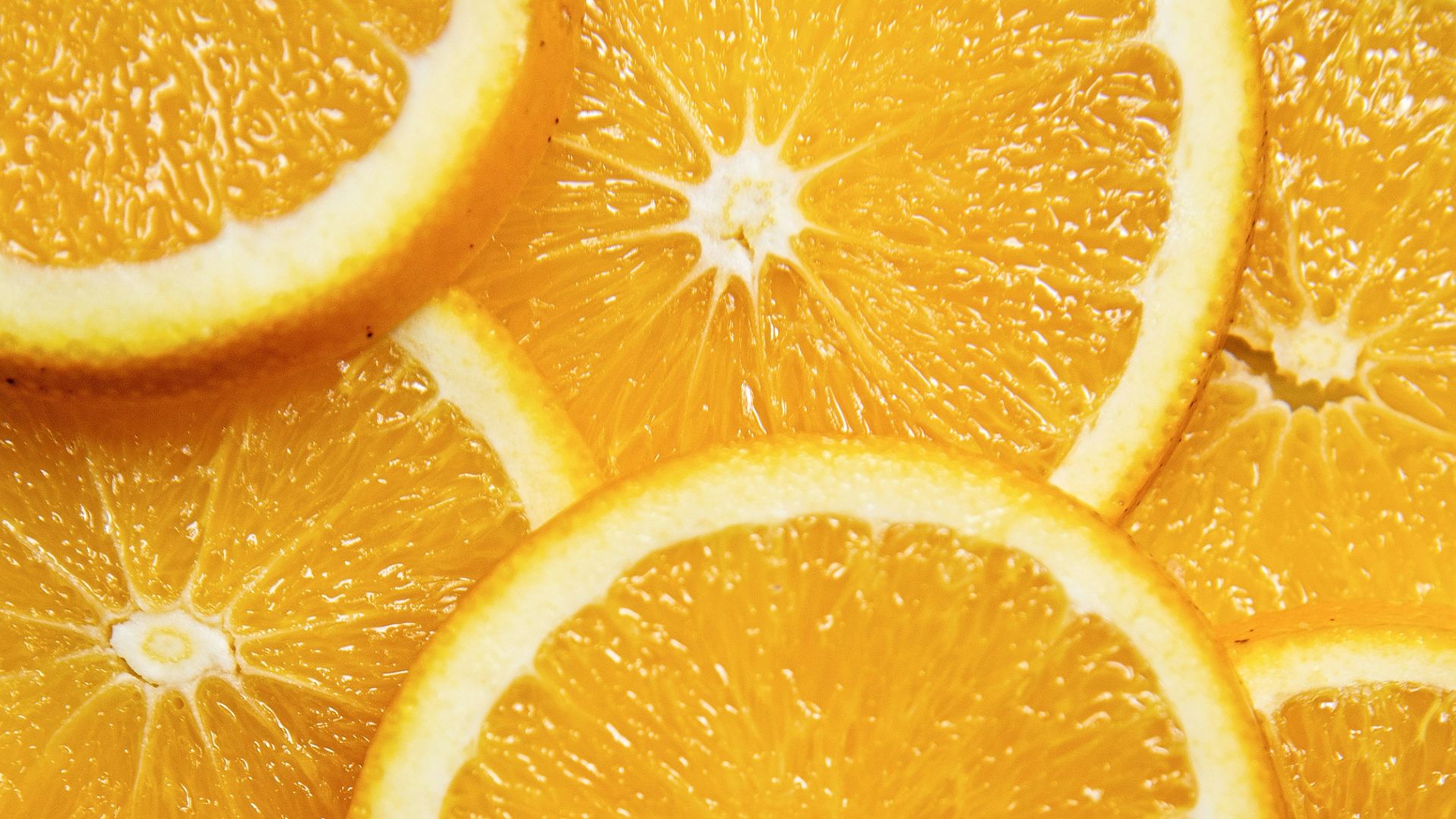 sliced orange fruit on white ceramic plate