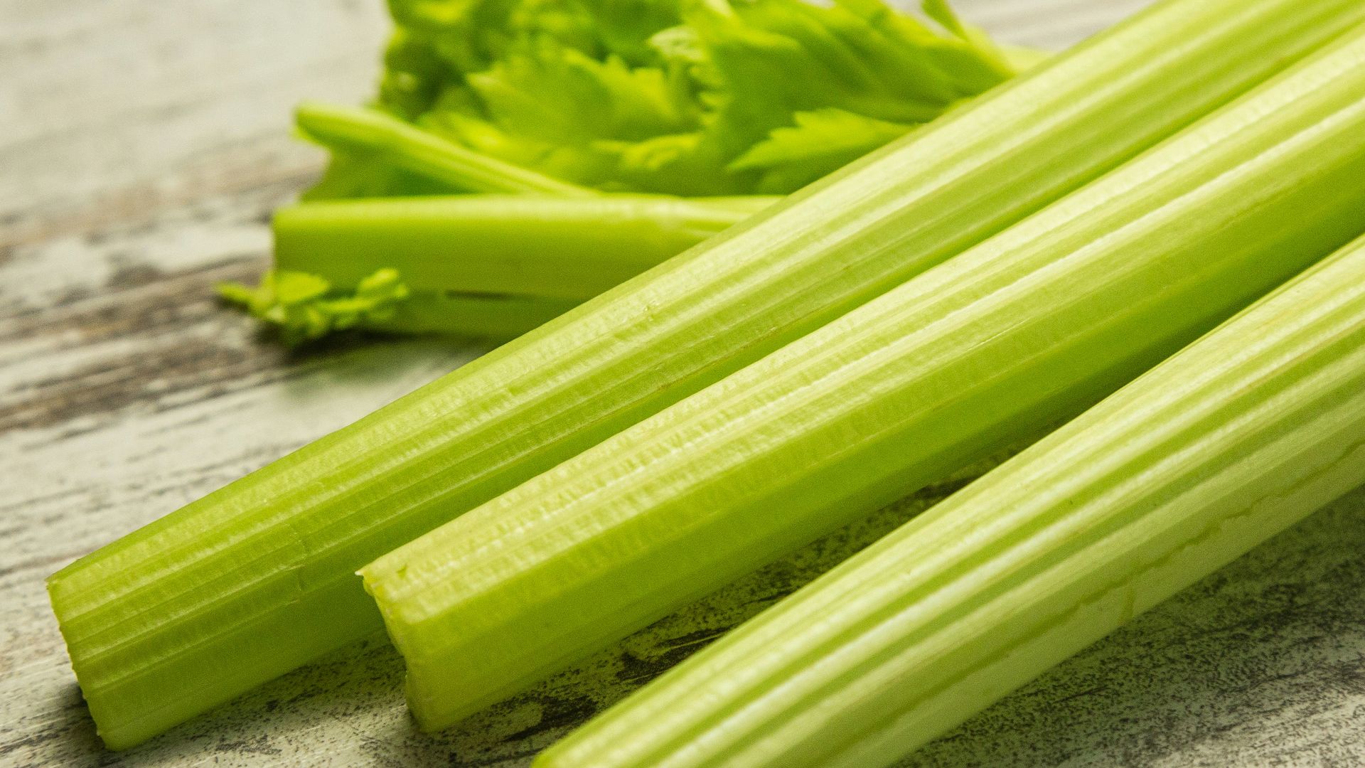 green vegetable on gray wooden table