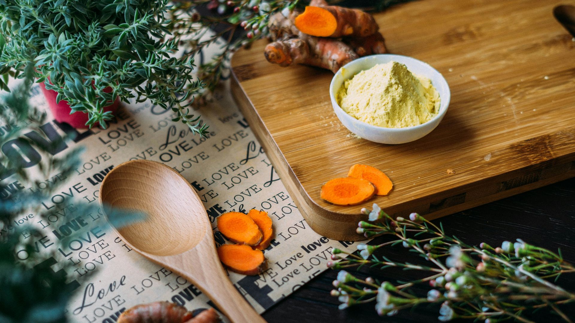 wooden ladle and chopping board with ginger during daytime