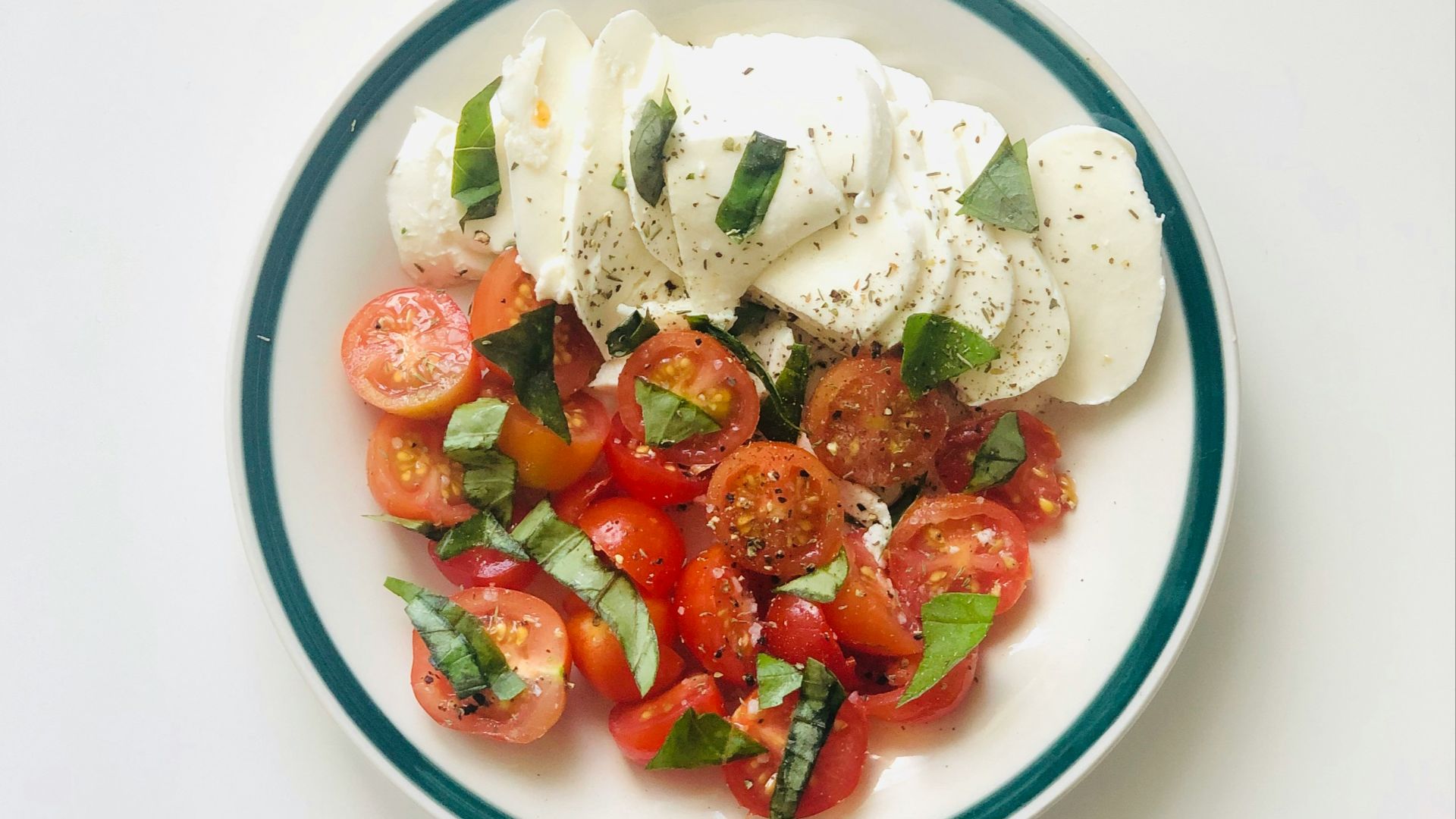 sliced strawberries on white ceramic bowl