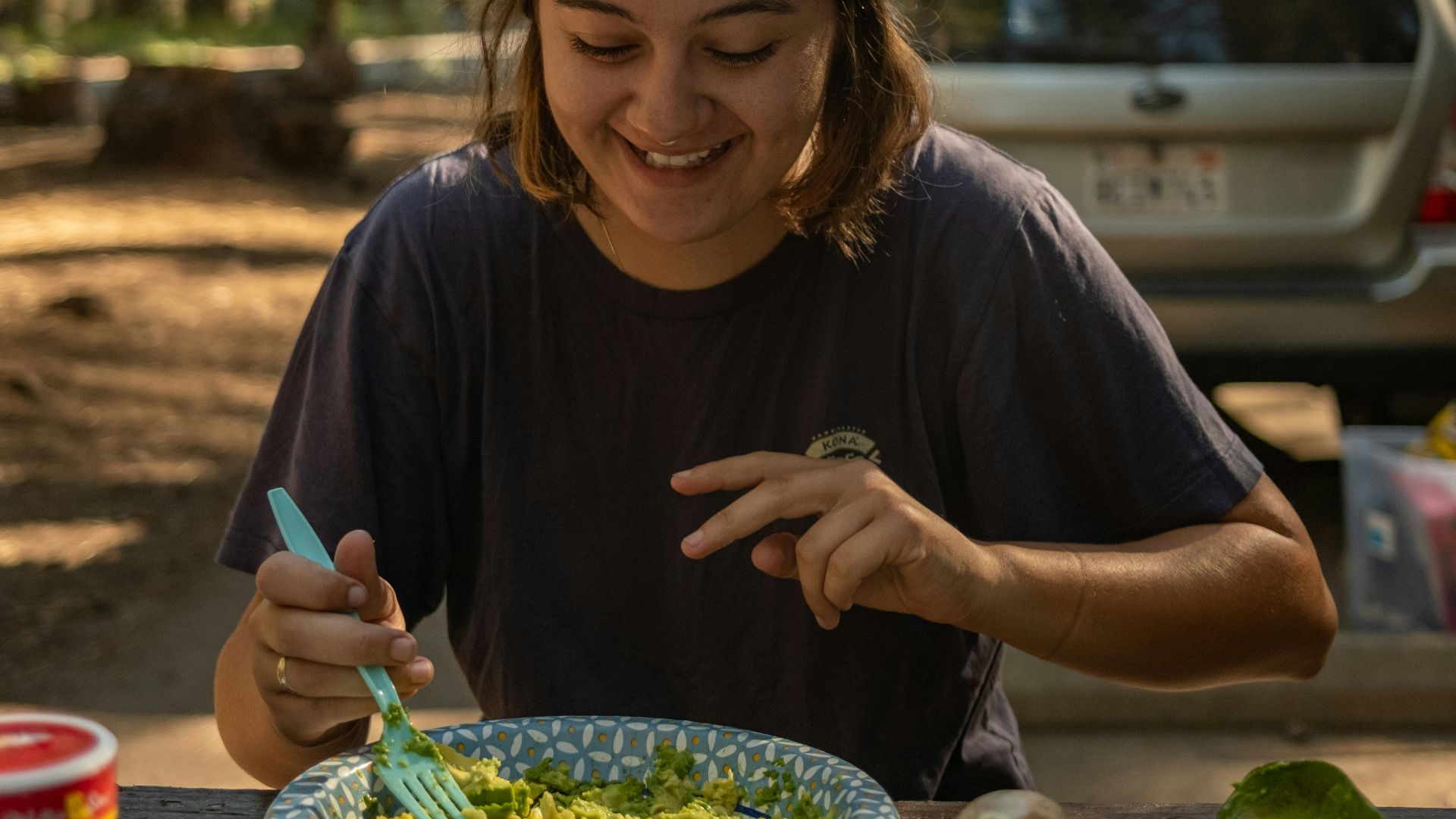 a person eating food at a table