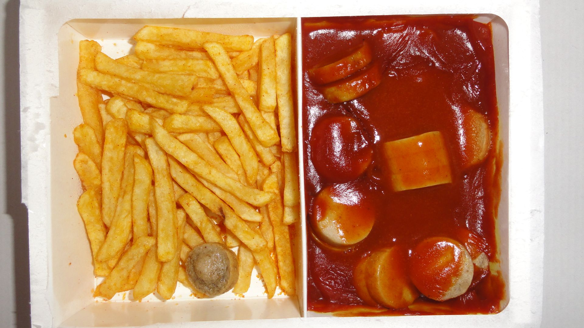 File:Ready to eat microwave food (TV dinner) Currywurst with French fries.JPG