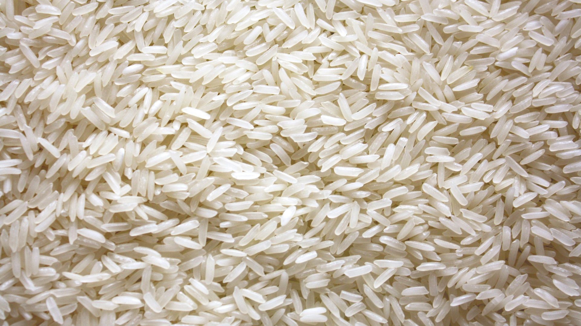a pile of white rice sitting on top of a table