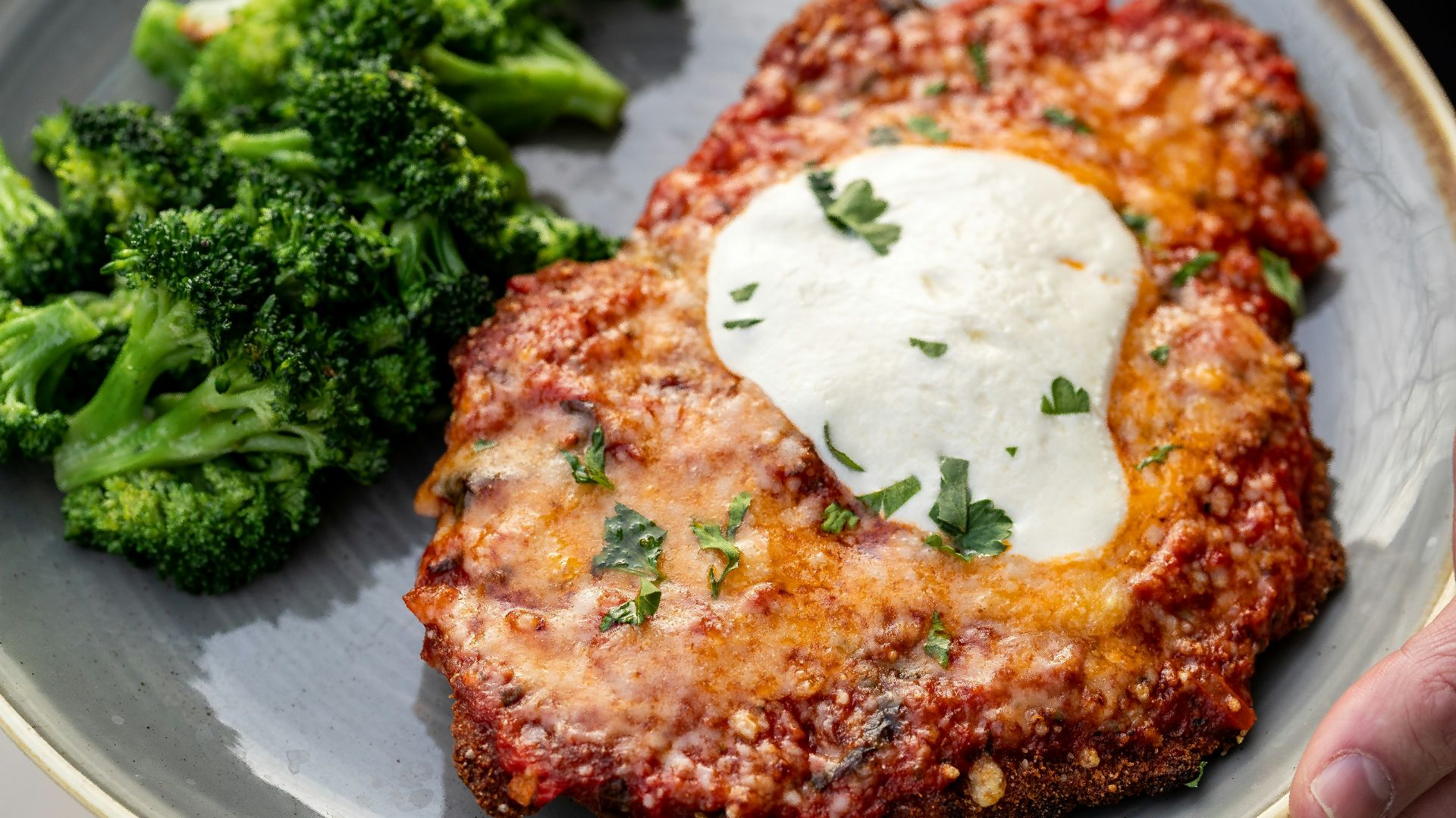 a plate of food with meat and broccoli