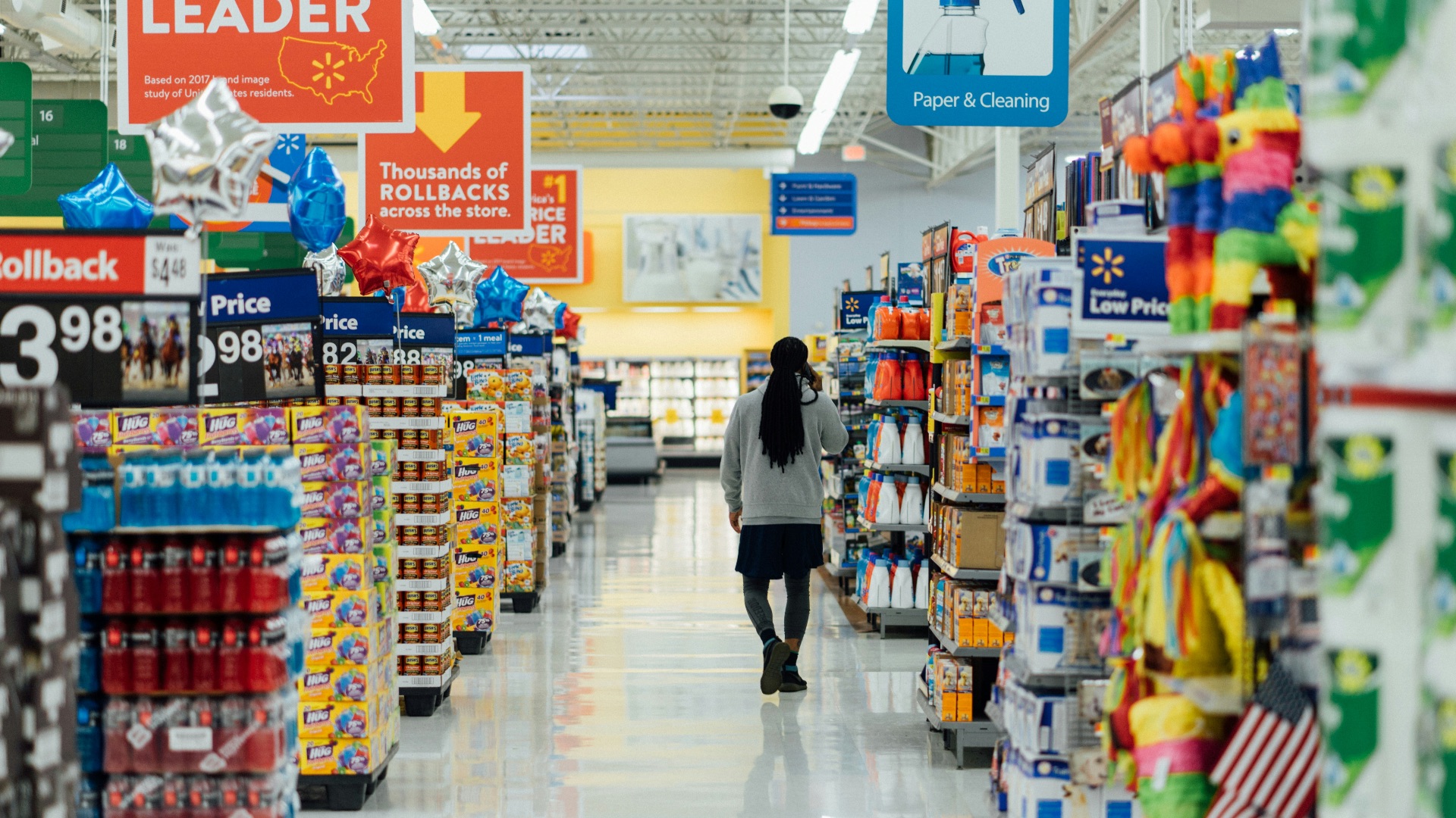 person standing between shelvings