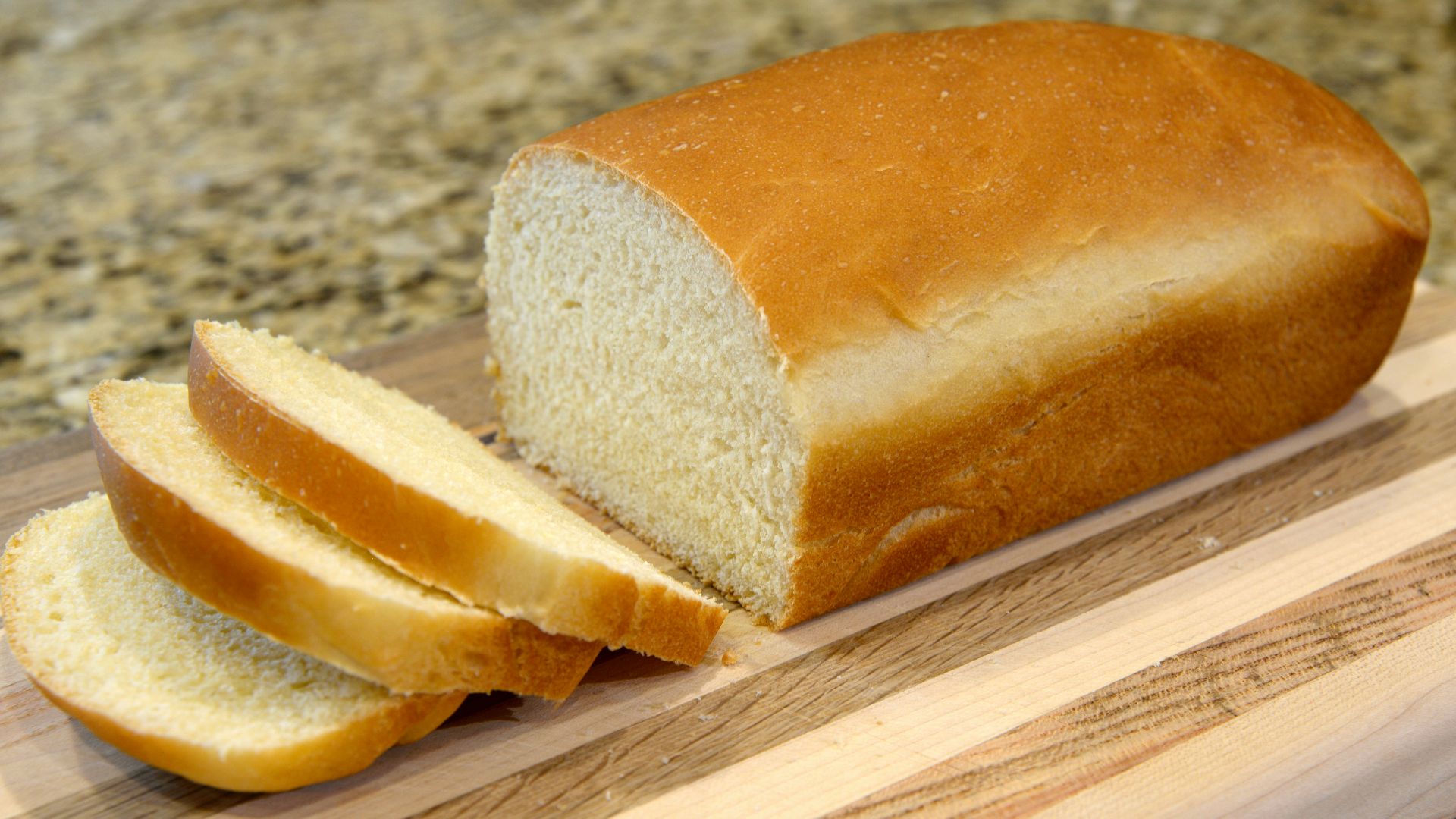 bread on brown wooden chopping board