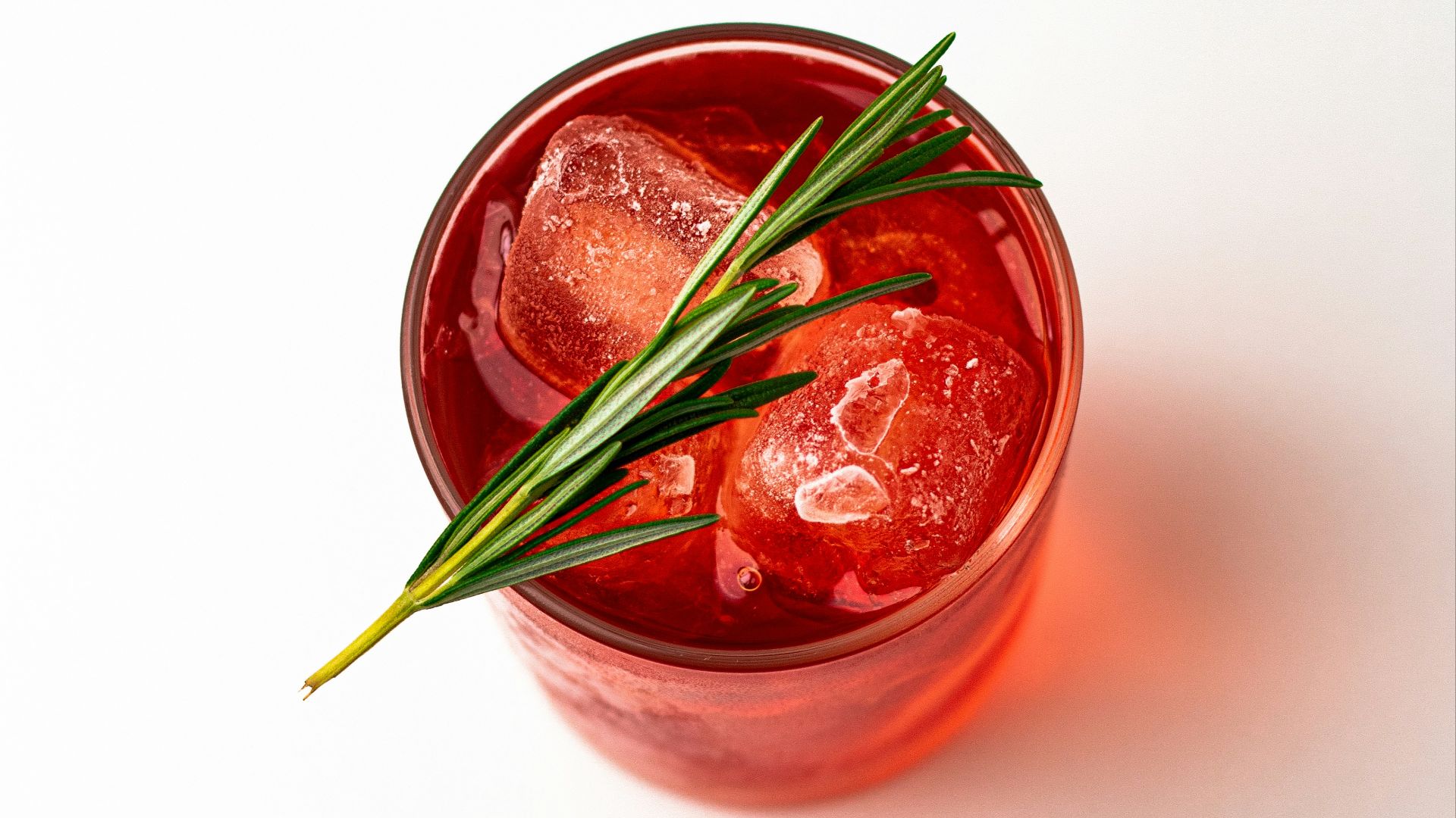 red liquid in clear glass jar