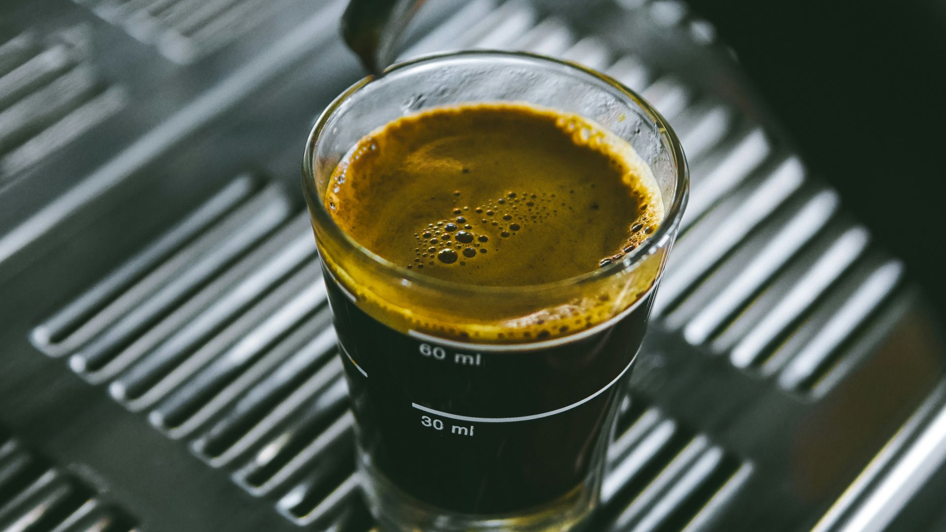 a glass of liquid on a table