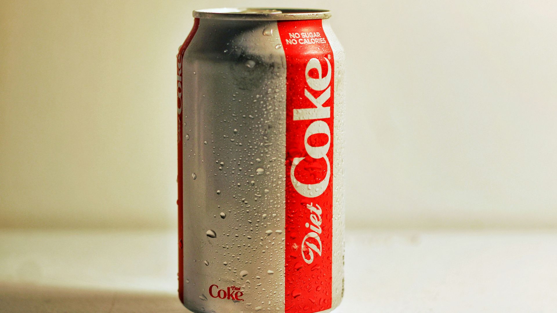 diet coke can on white table