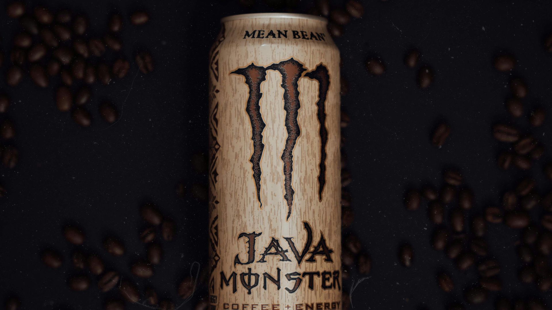 a can of coffee with a monster logo on it