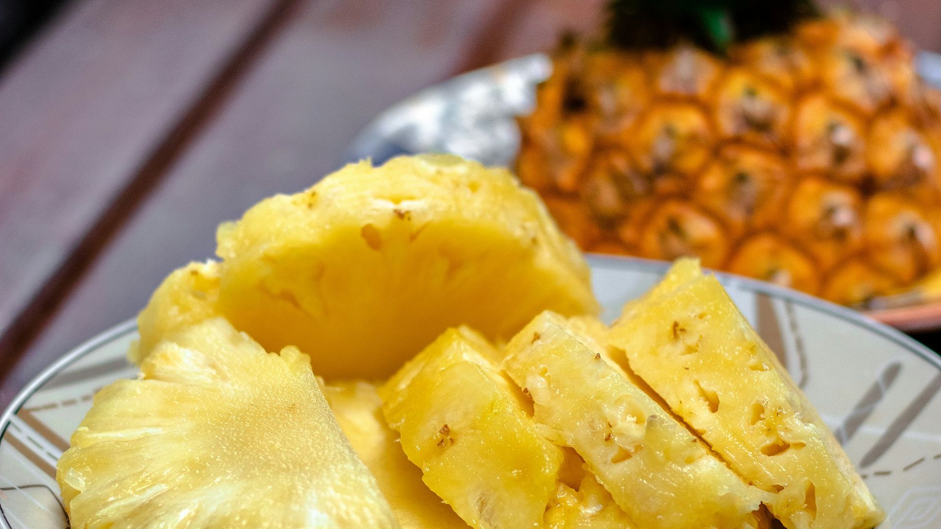 sliced pineapple on white ceramic plate