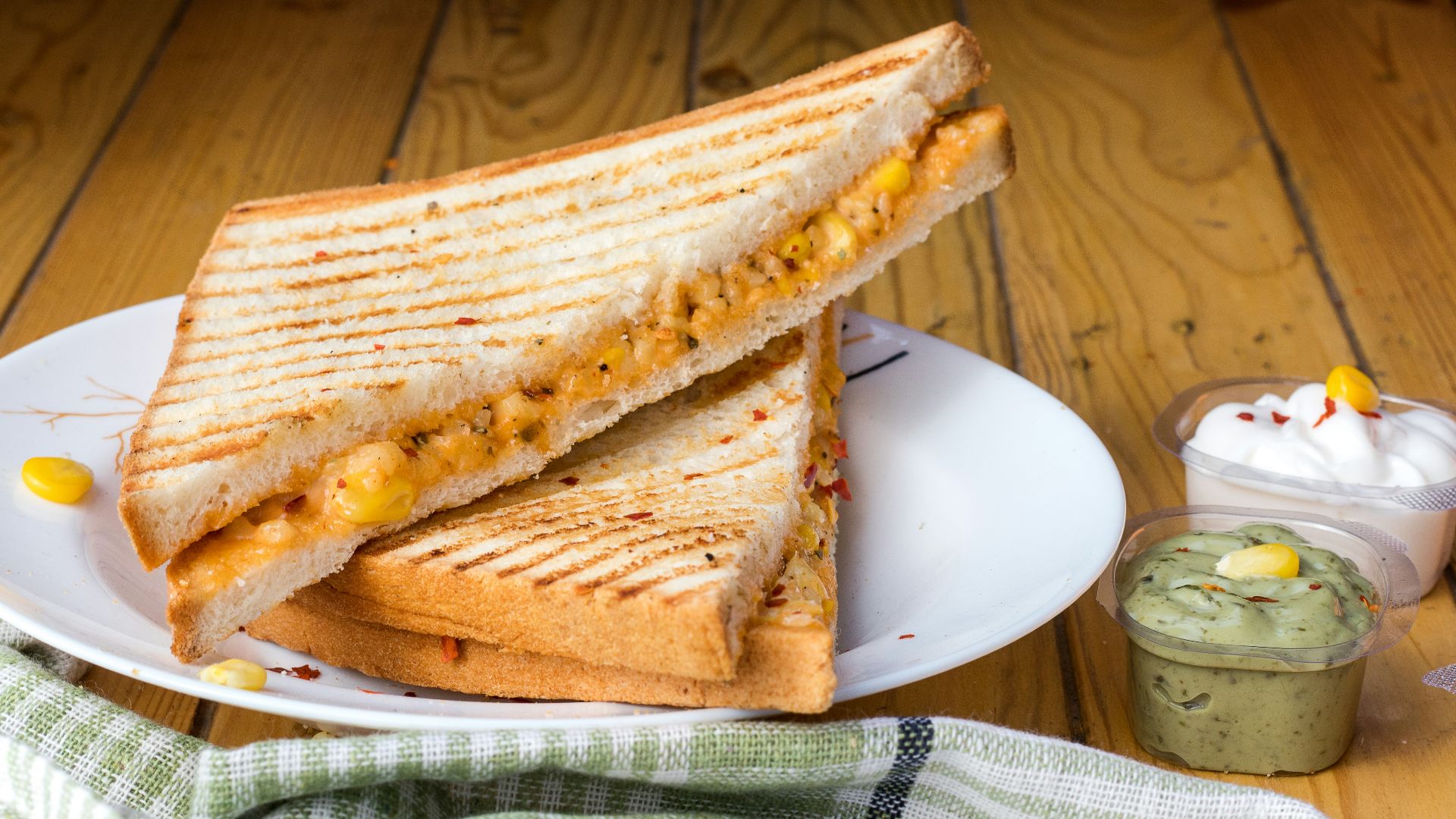 bread with cheese fillings on white ceramic plate