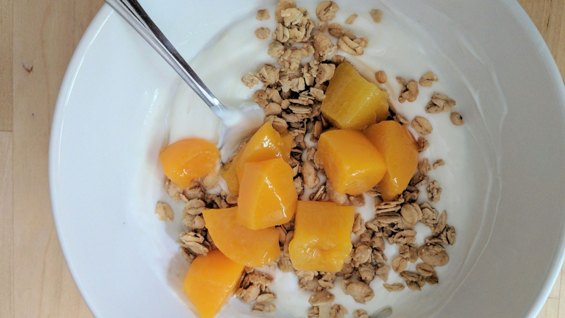 cereal with milk in ceramic bowl