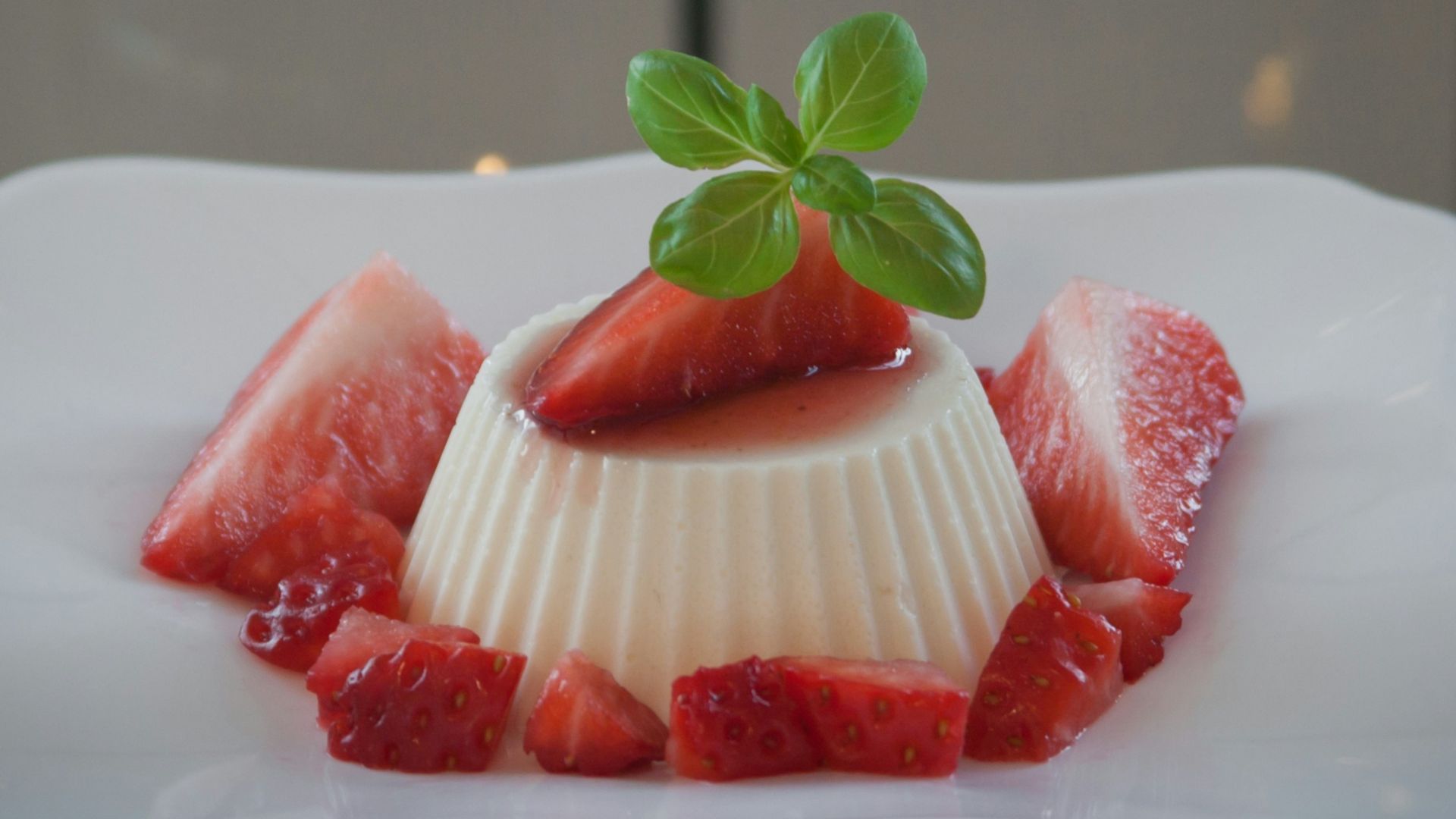 strawberry on white ceramic plate