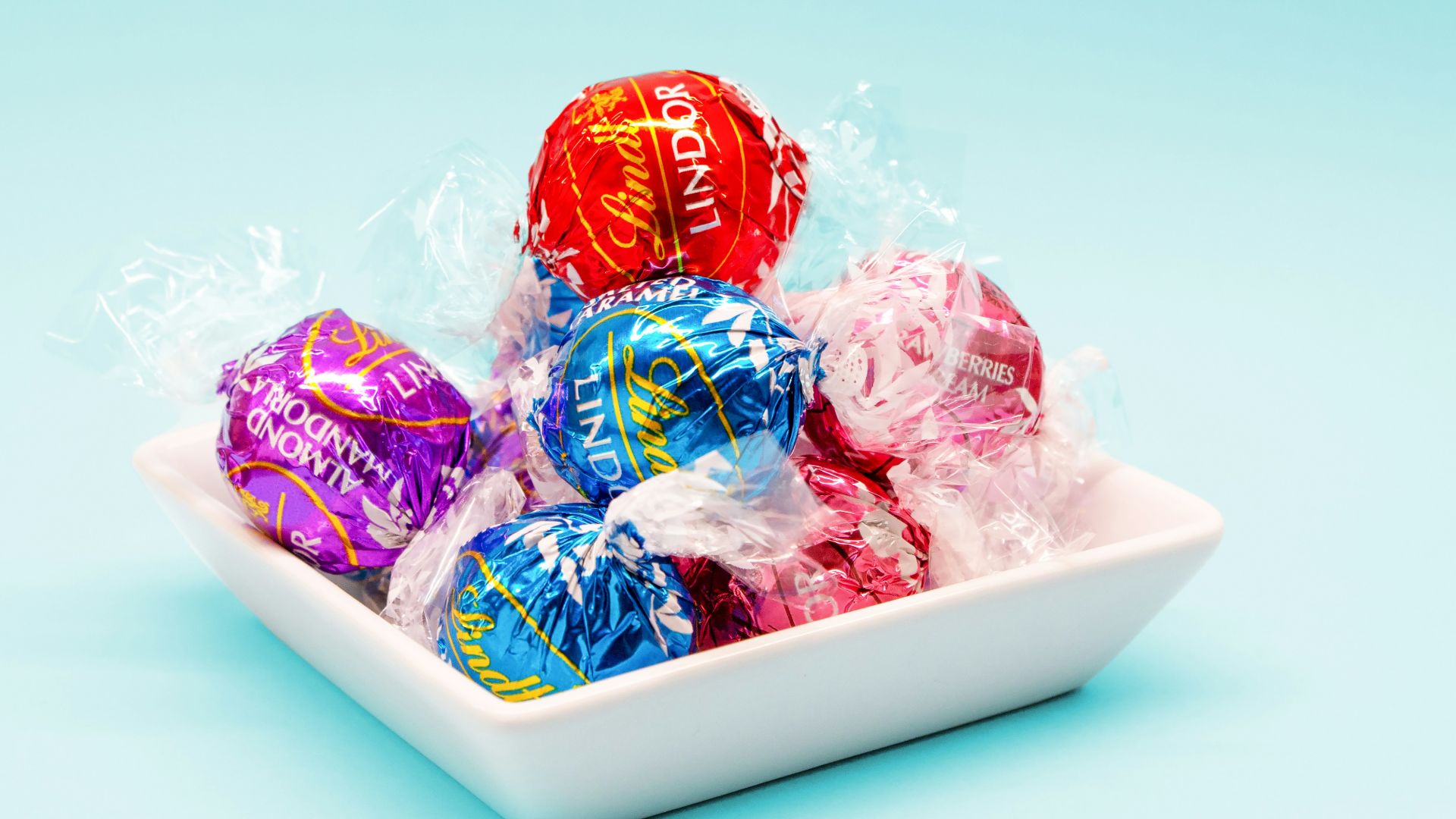 red and blue candy on white ceramic tray