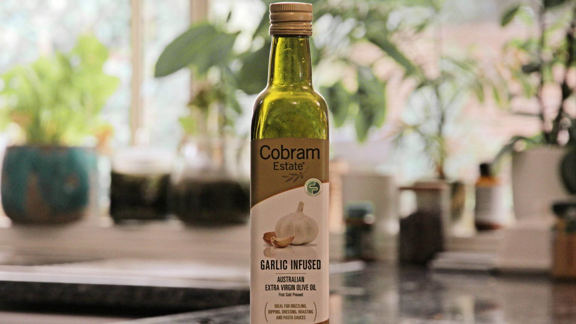 a bottle of garlic oil sitting on top of a counter