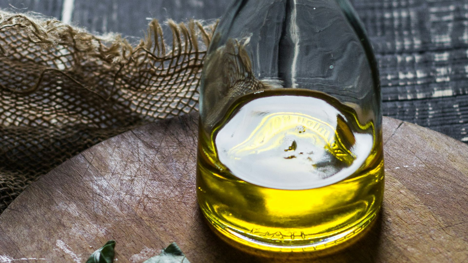 clear glass bottle with yellow liquid