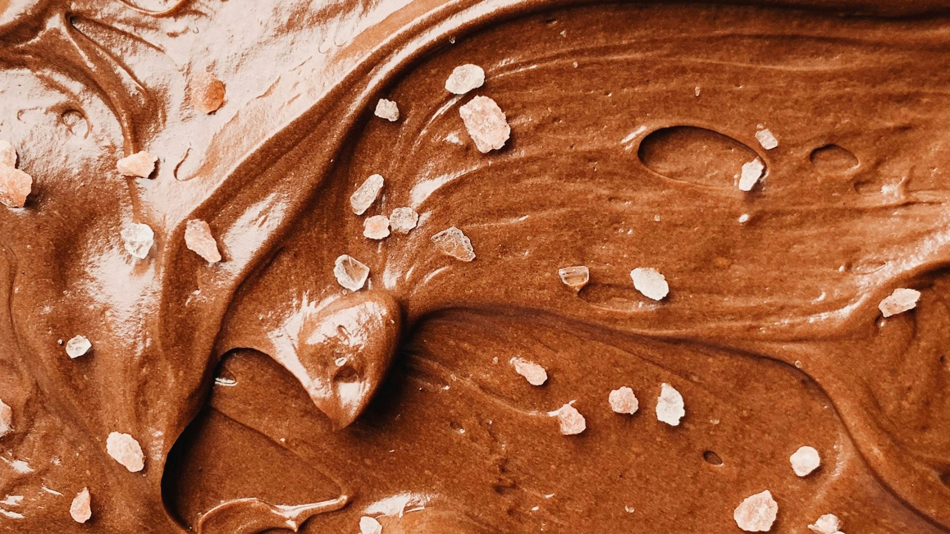 a close up of a chocolate frosted cake