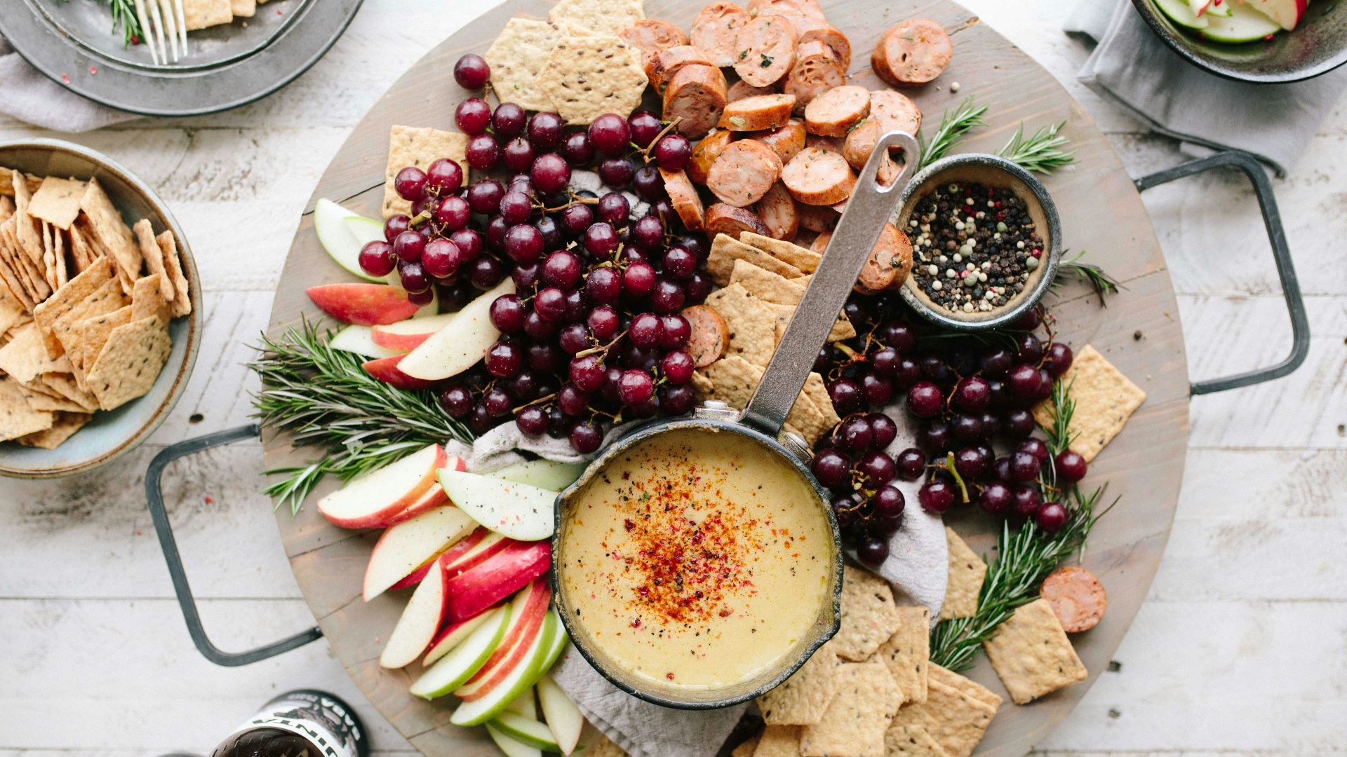 flat lay photography of sliced apples, sausages, chips and brown sauce