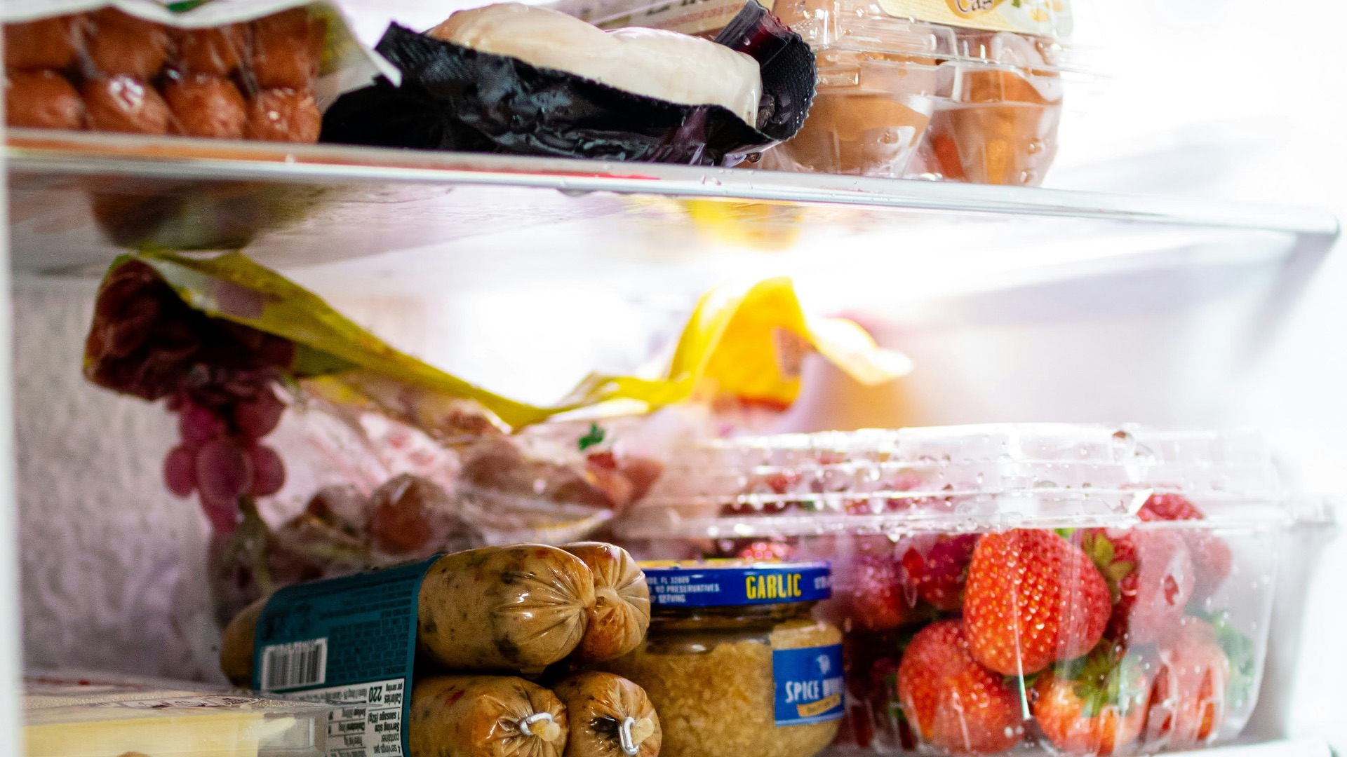 a refrigerator filled with lots of food and drinks