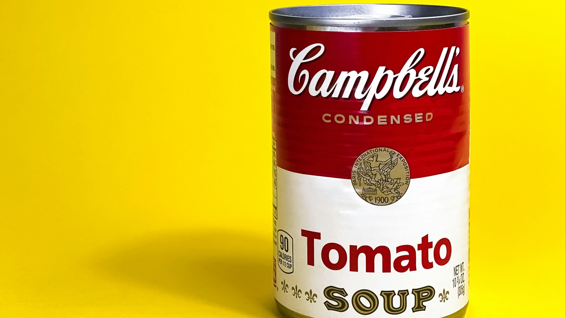 a can of soup on a yellow background