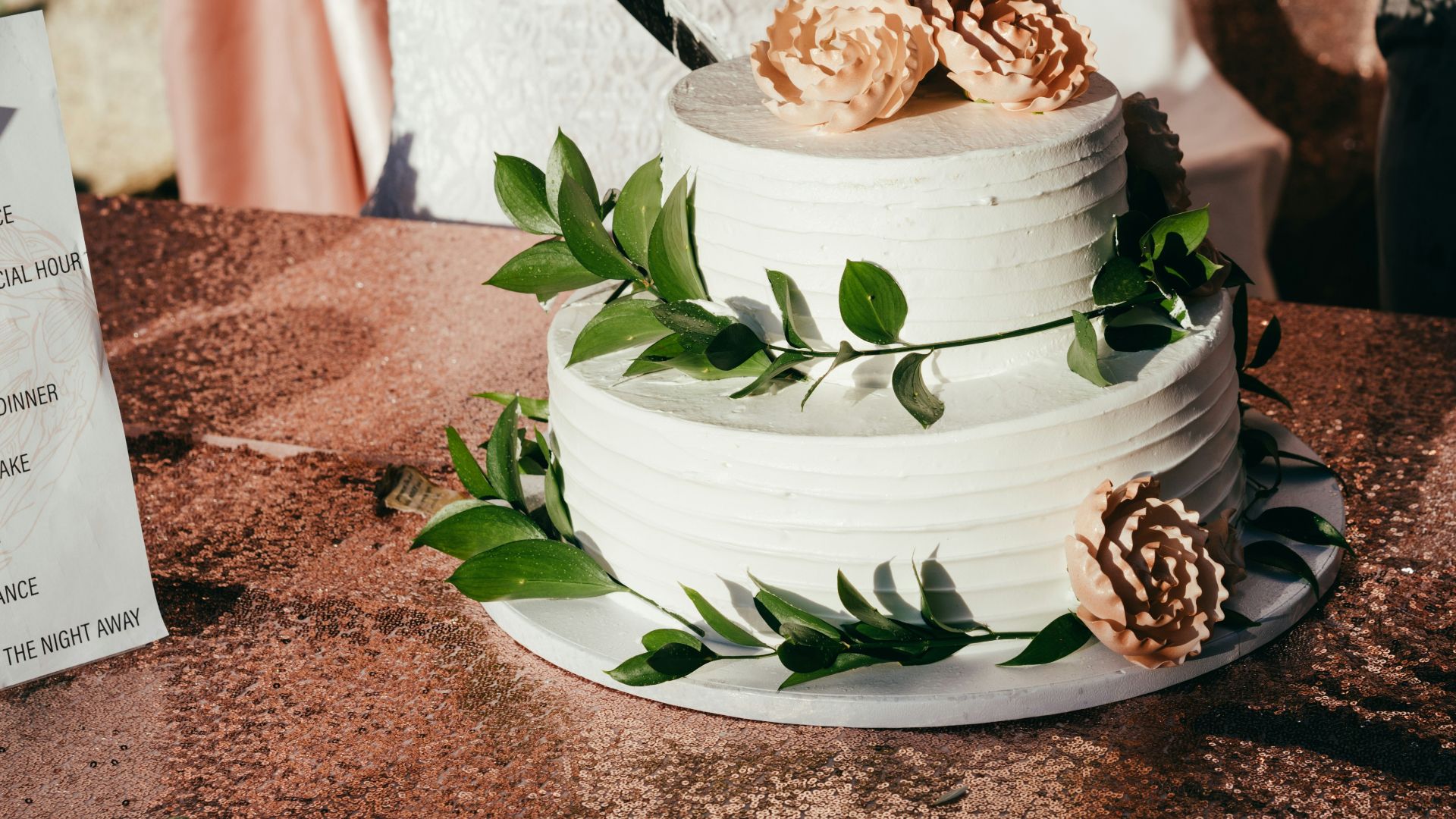 woman in white dress holding white and blue floral ceramic bowl with food