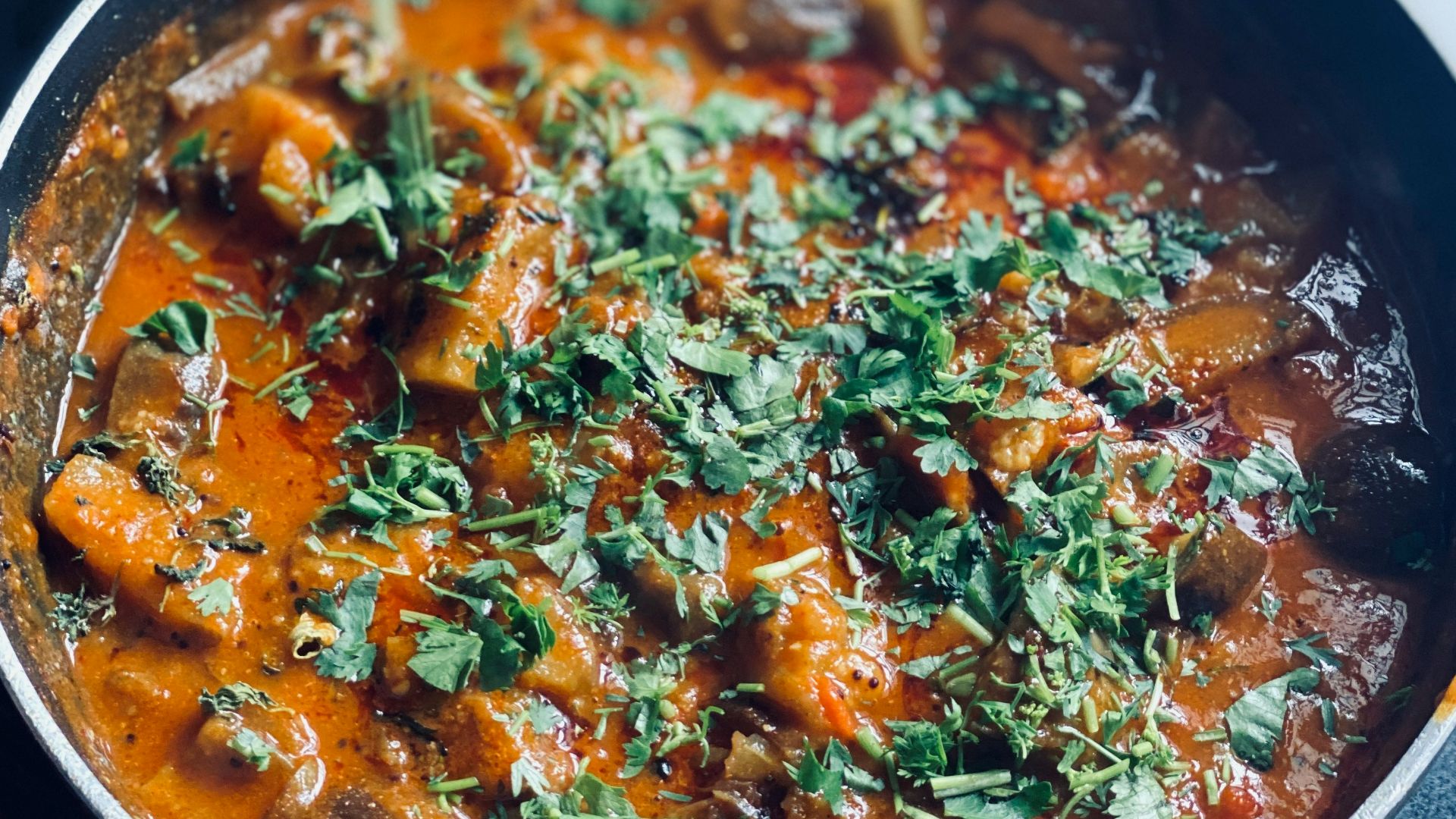 cooked food in black cooking pot