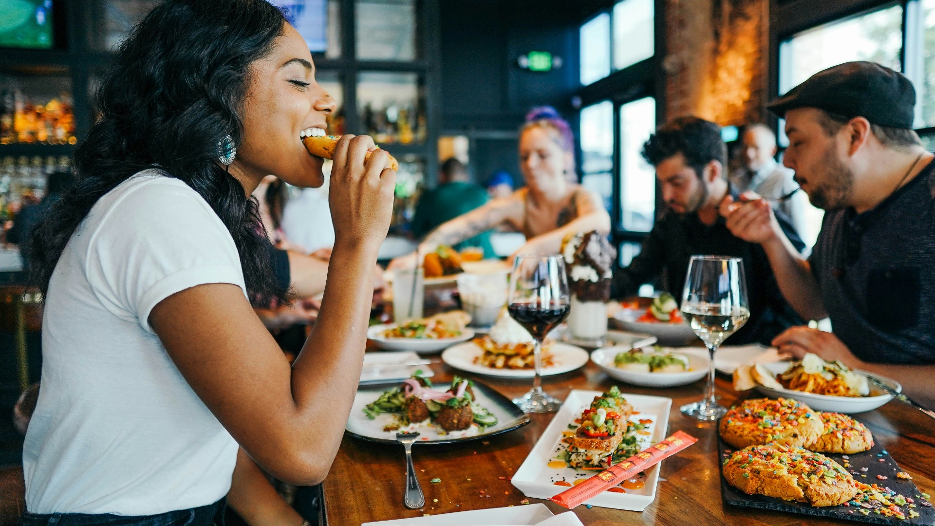 woman in white shirt eating