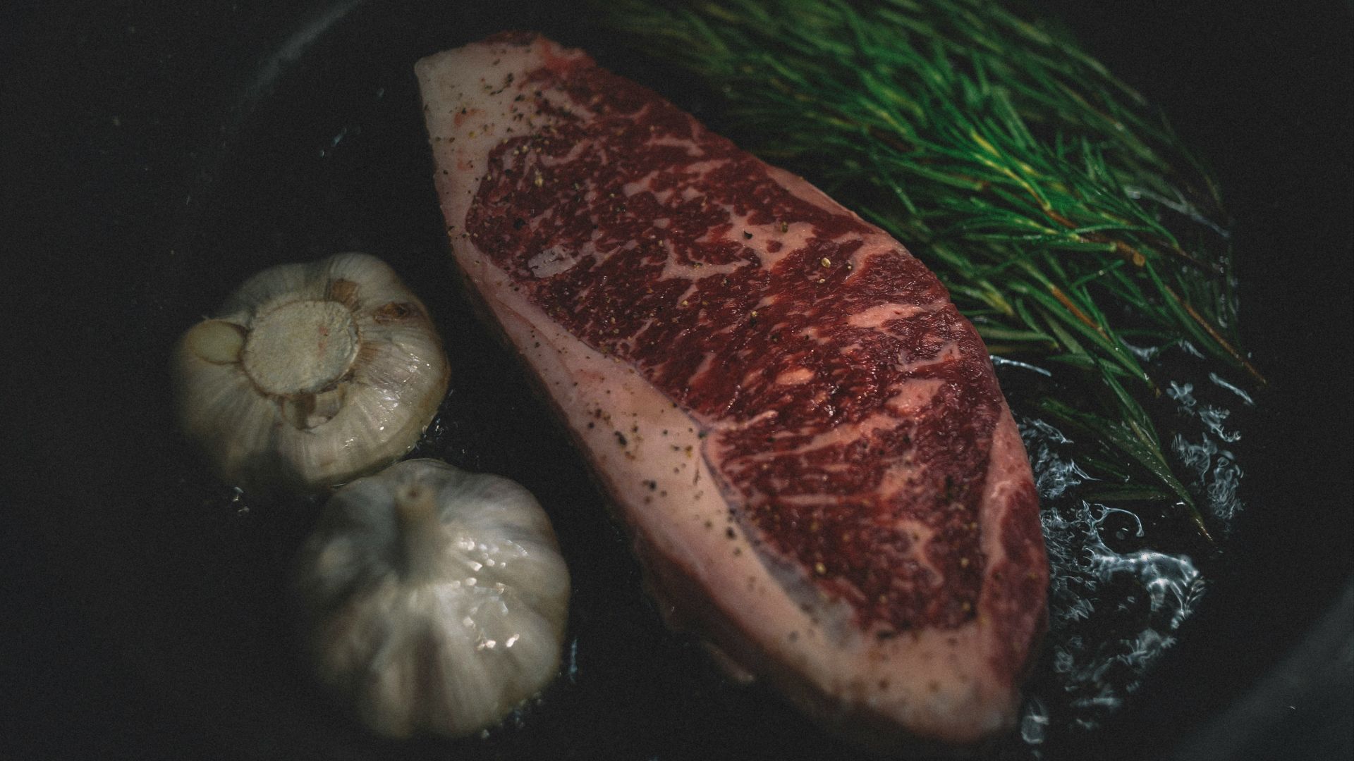 raw meat on black plate