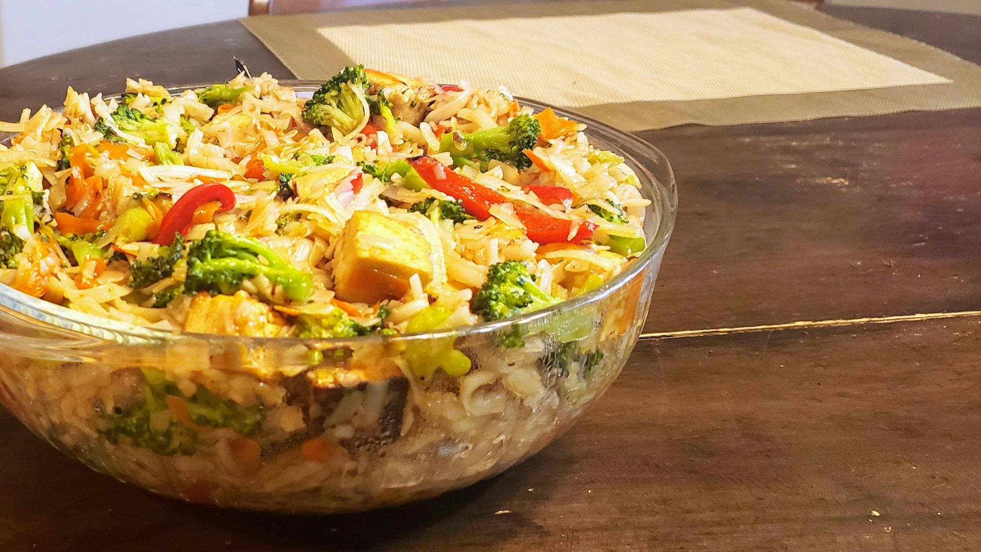 A bowl of food sitting on top of a wooden table