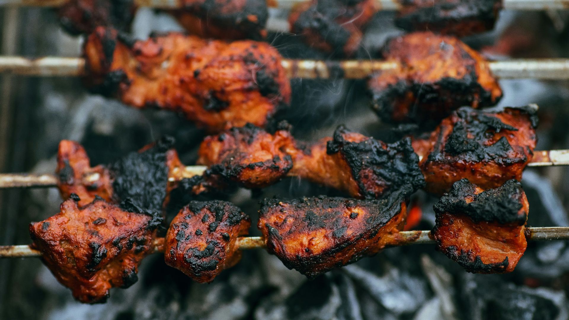 a pile of red and black leaves