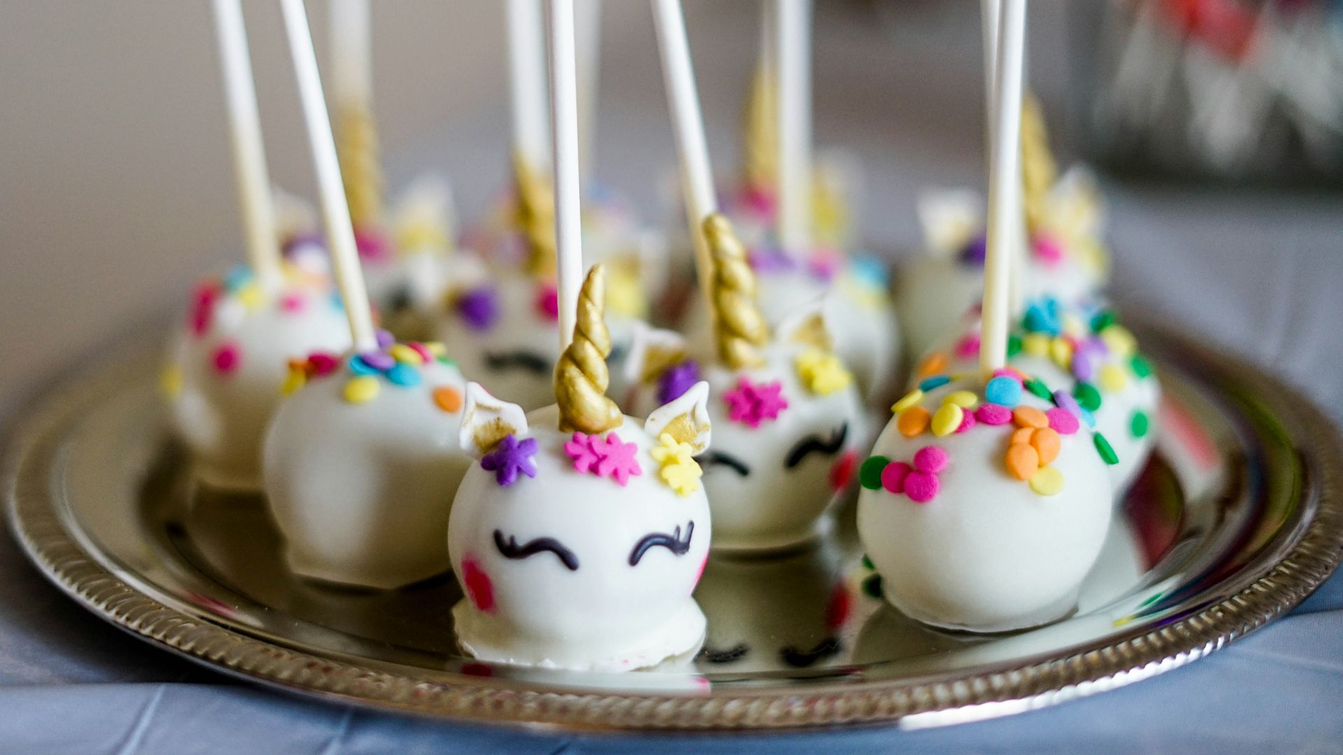 shallow focus photo of unicorn lollipops