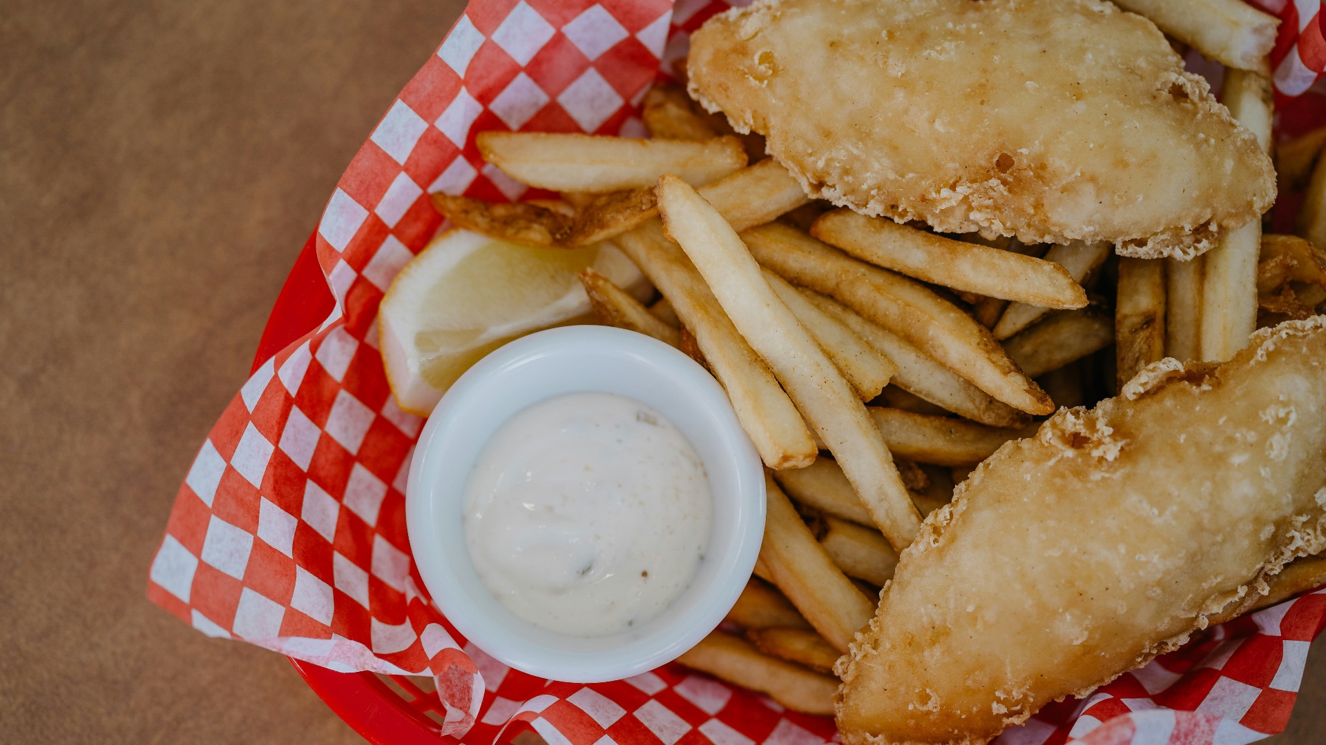 fried food on red and white checkered plate