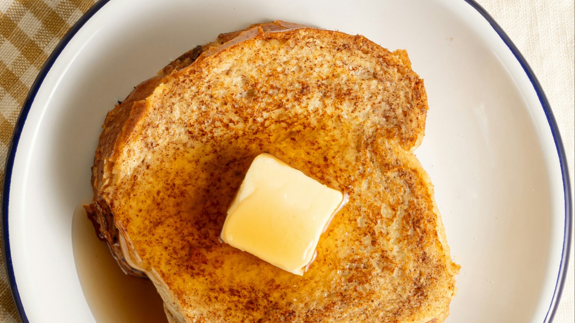 French toast with butter and syrup awaits.