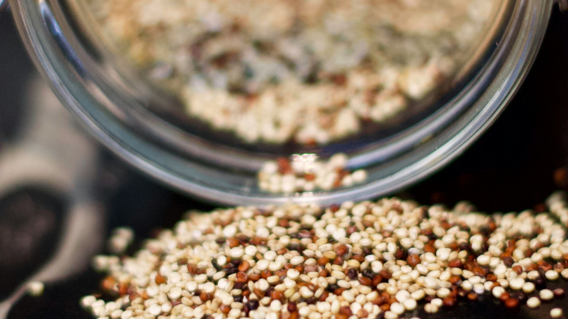 brown coffee beans in clear glass jar