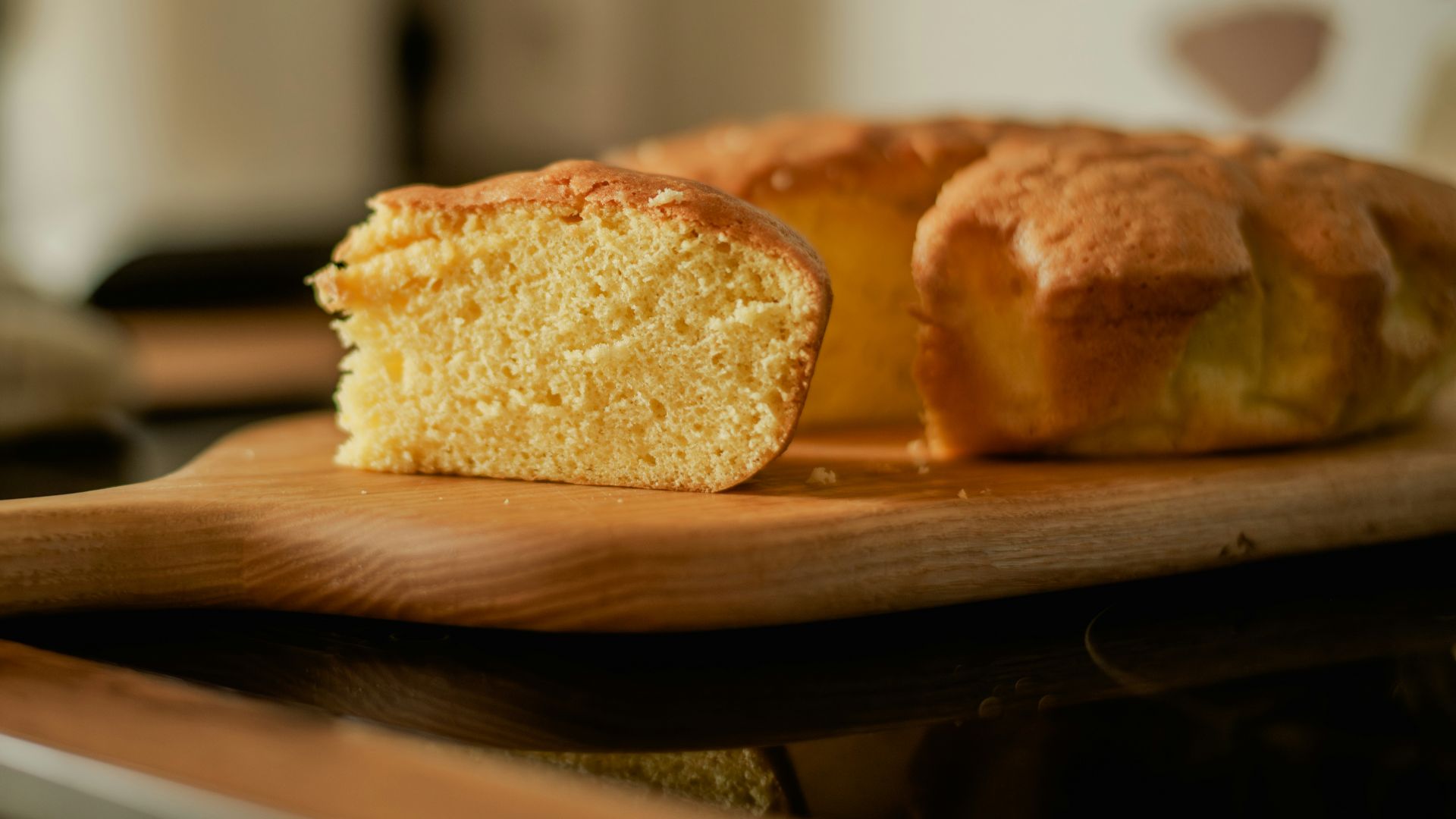 A loaf of bread sitting on top of a wooden cutting board