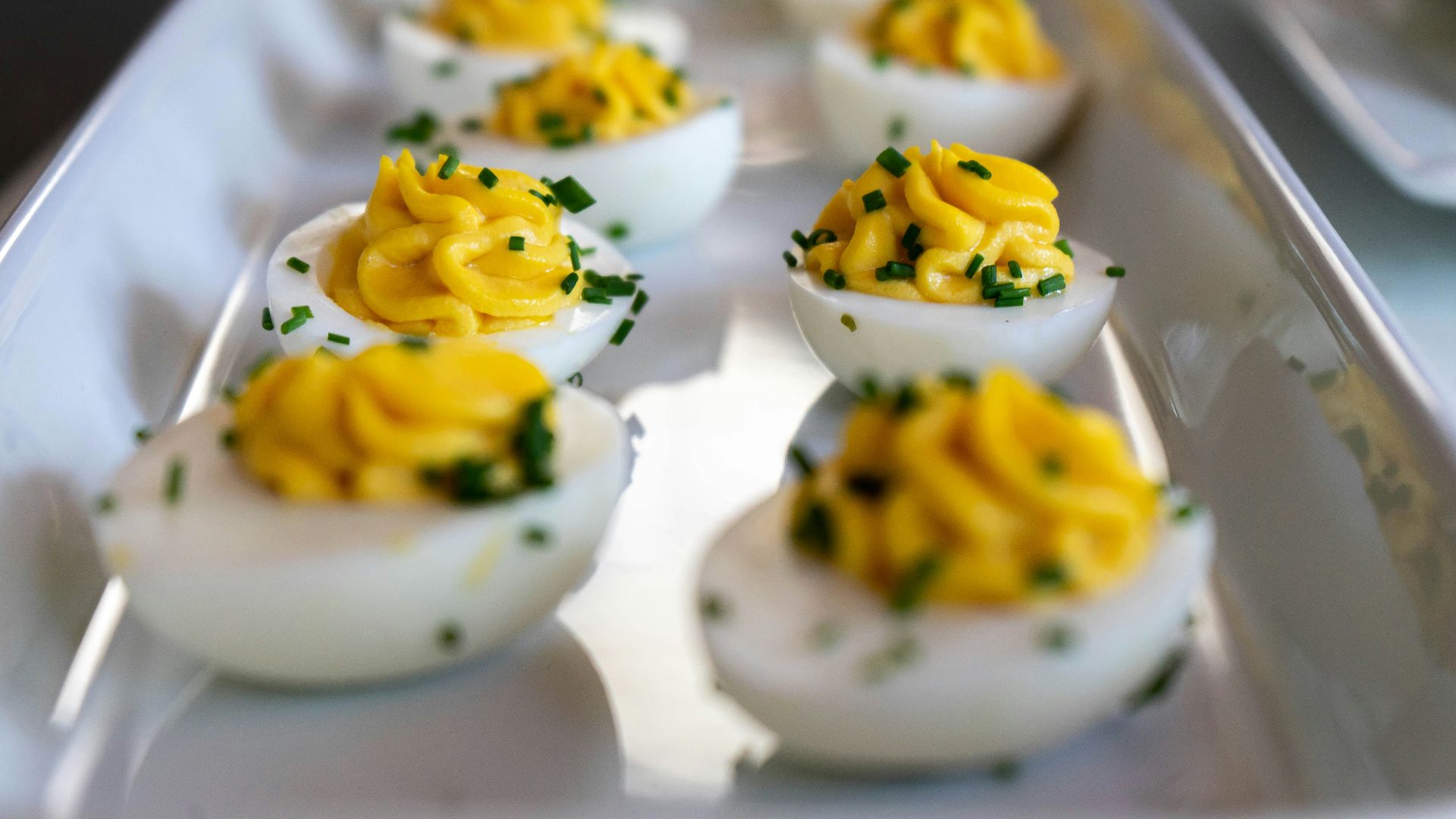 white and yellow icing covered cupcakes