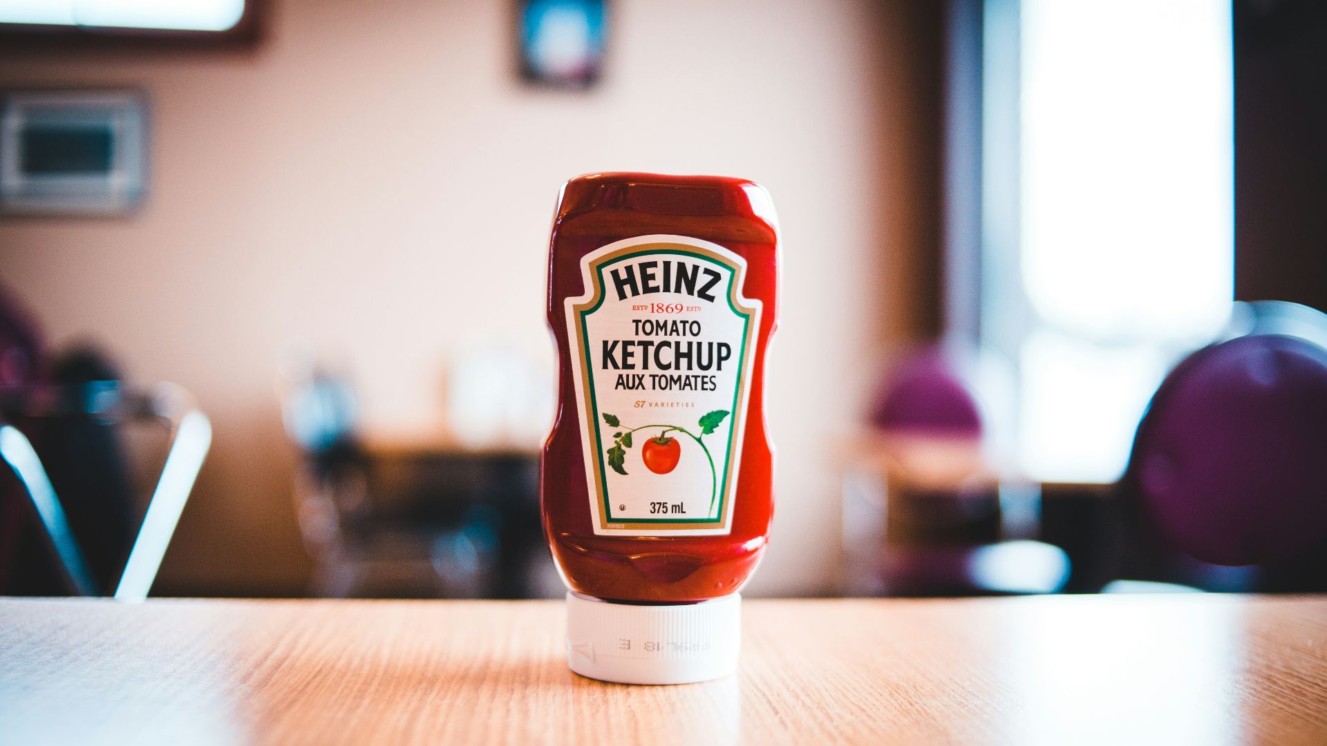 heinz tomato ketchup bottle on brown wooden table