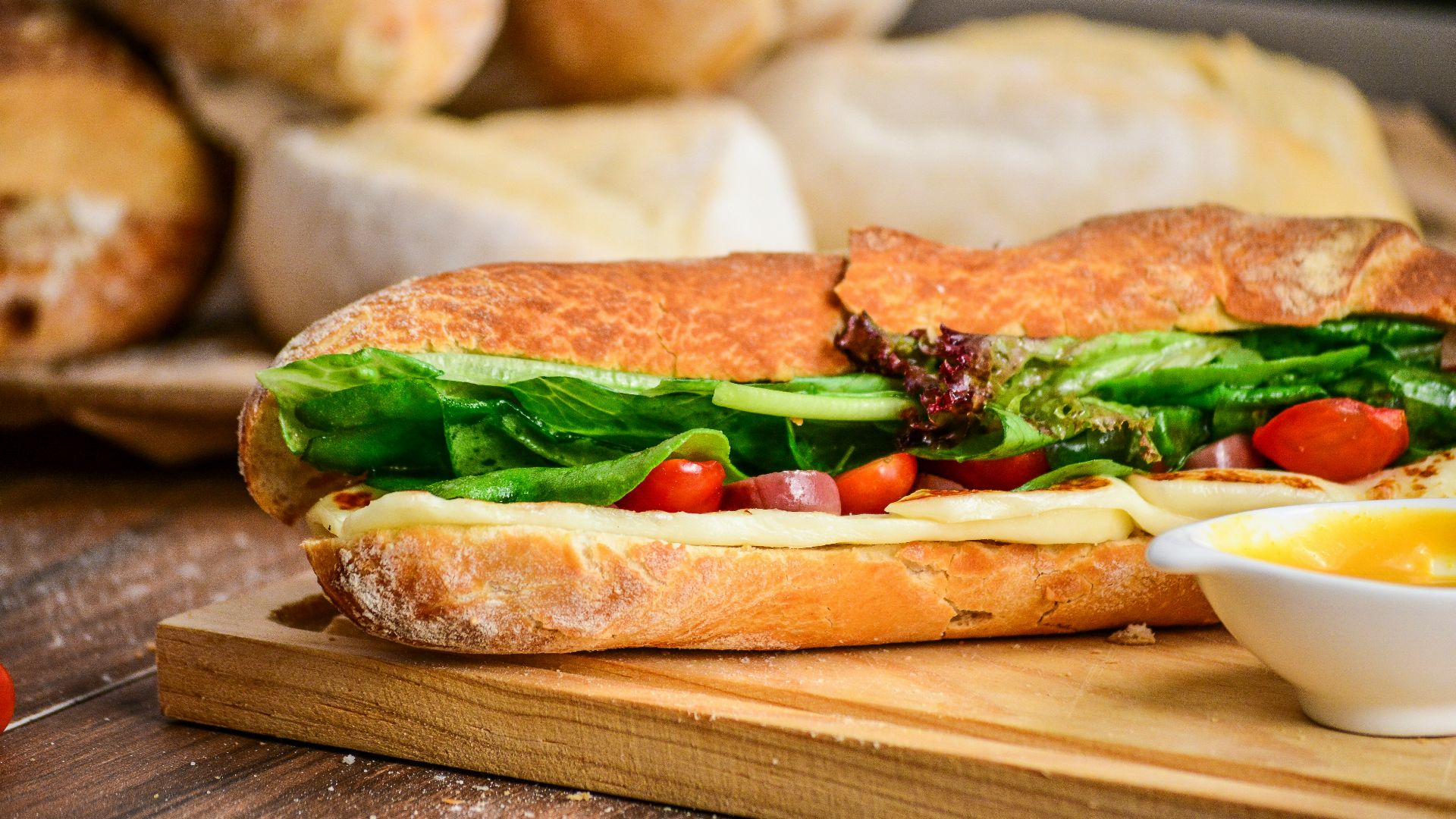 baked bread with vegetable on brown chopping board