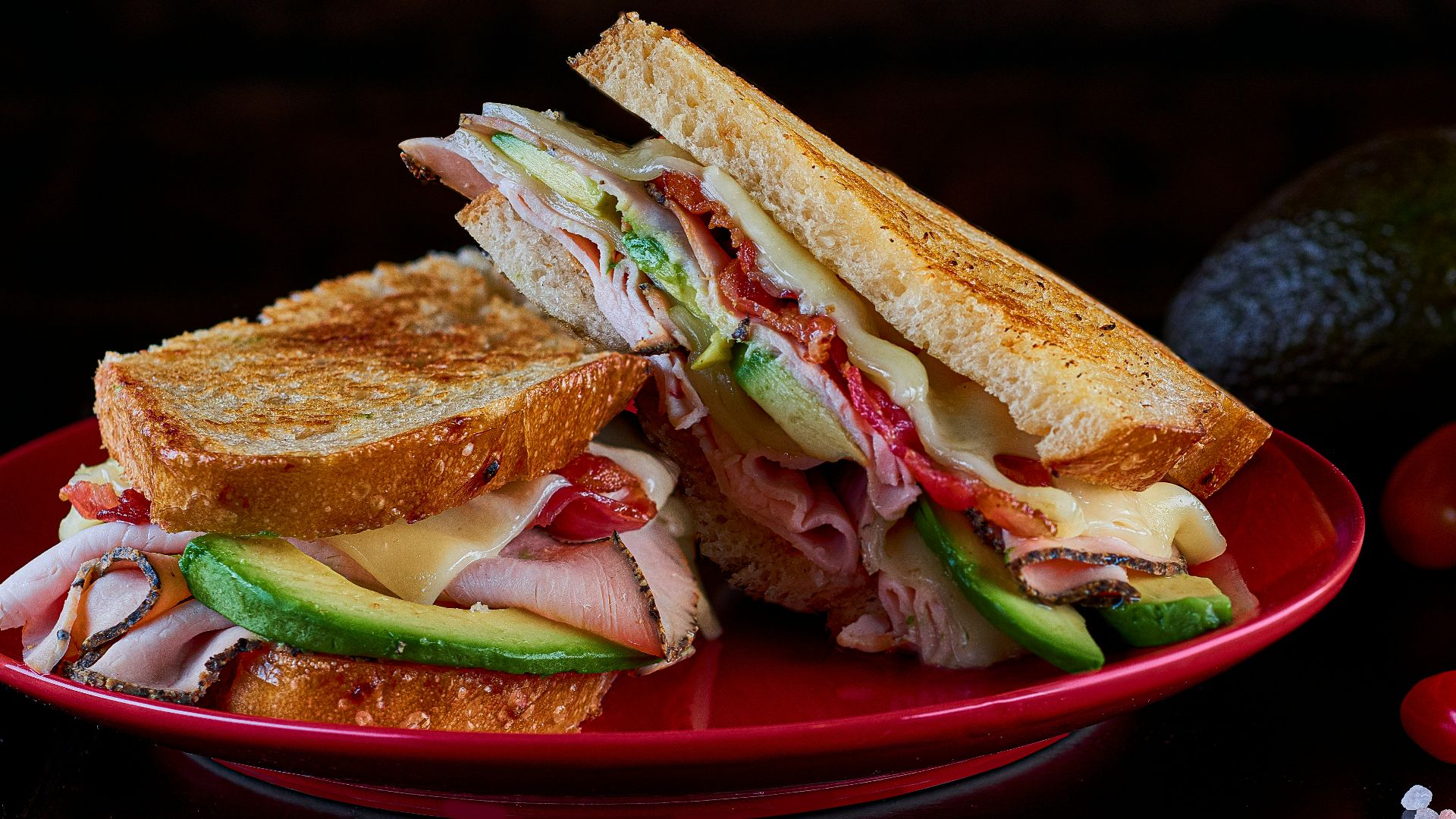 sandwich on red ceramic plate