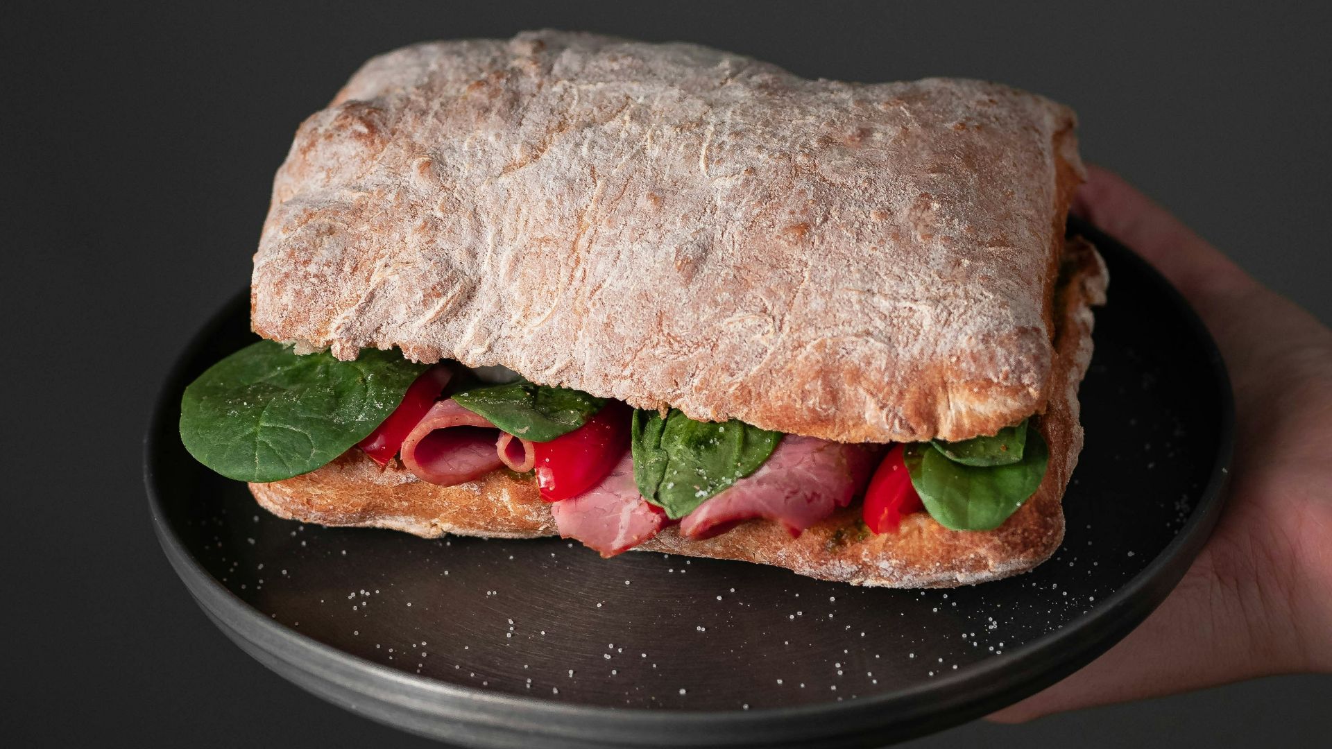burger on black ceramic plate