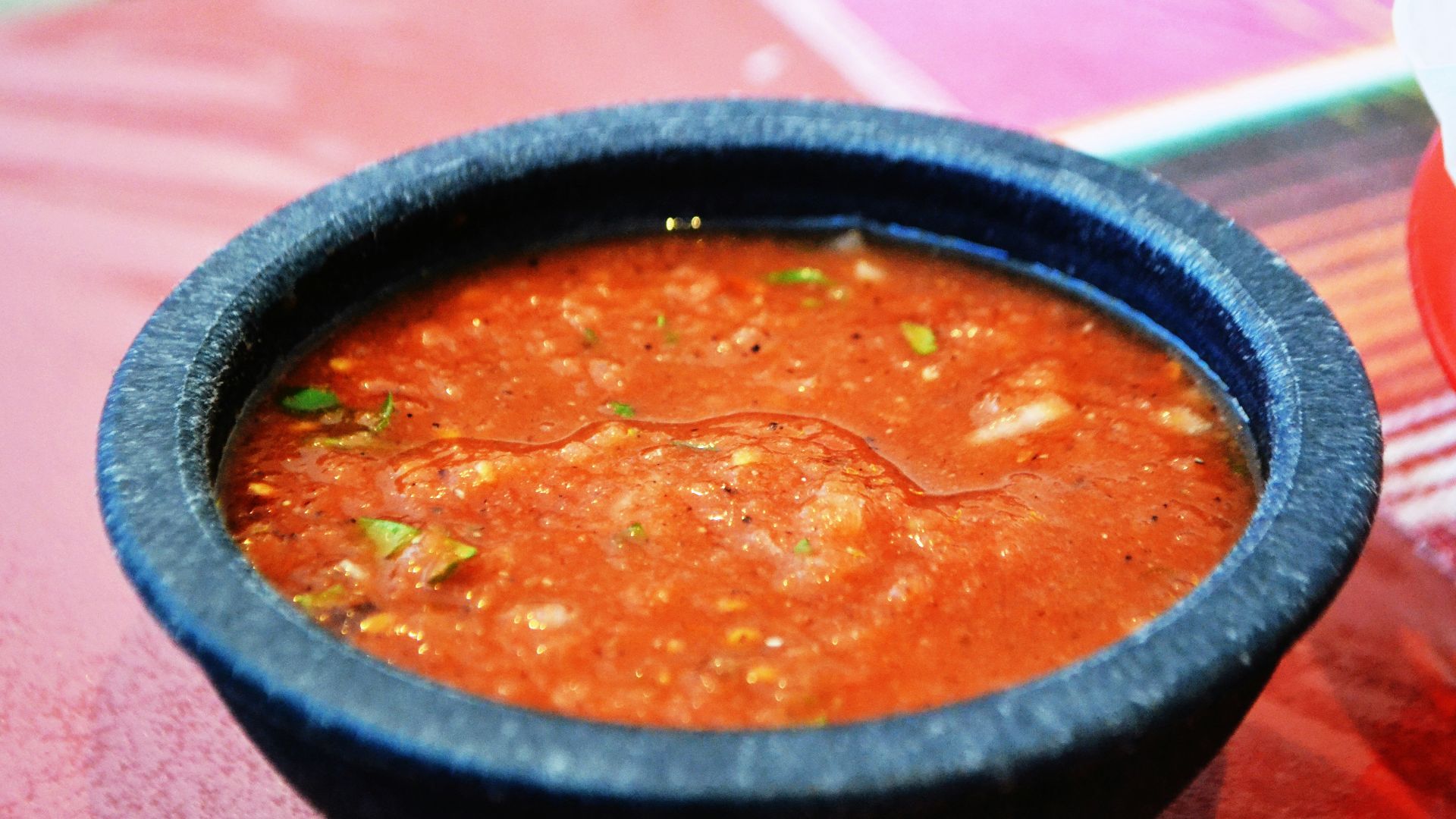 a bowl of soup sitting on top of a table